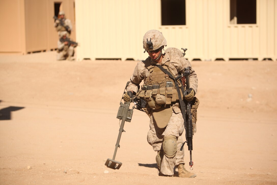 Marines with  1st Battalion, 5th Marine Regiment patrol the streets of the Combat Center’s new combined arms, live-fire, Military Operations on Urban Terrain training range, in search of improvised explosive devices  as part of Enhanced Mojave Viper, Feb. 15, 2011.