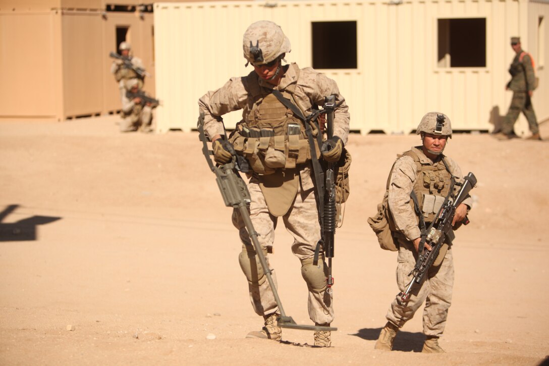 Marines with  1st Battalion, 5th Marine Regiment patrol the streets of the Combat Center’s new combined arms, live-fire, Military Operations on Urban Terrain training range, in search of improvised explosive devices  as part of Enhanced Mojave Viper, Feb. 15, 2011.