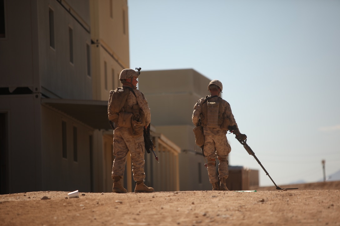 Marines with  1st Battalion, 5th Marine Regiment patrol the streets of the Combat Center’s new combined arms, live-fire, Military Operations on Urban Terrain training range, in search of improvised explosive devices  as part of Enhanced Mojave Viper, Feb. 15, 2011.