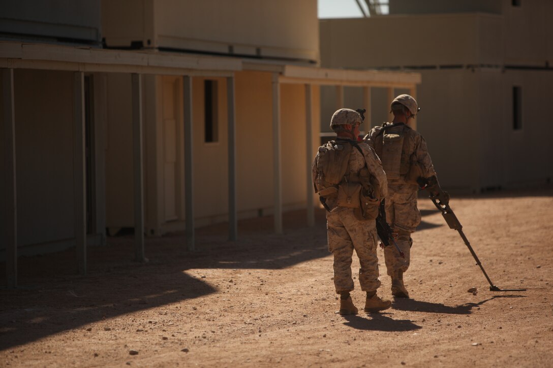 Marines with  1st Battalion, 5th Marine Regiment patrol the streets of the Combat Center’s new combined arms, live-fire, Military Operations on Urban Terrain training range, in search of improvised explosive devices  as part of Enhanced Mojave Viper, Feb. 15, 2011.