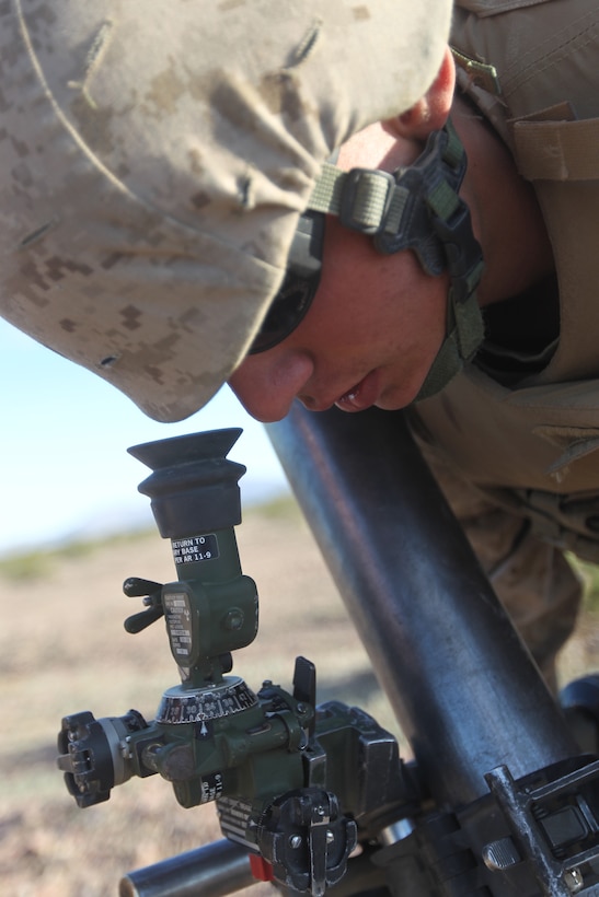 Private First Class Samuel Robertson, a mortarmen with Weapons Company, 2nd Battalion, 7th Marine Regiment, lines up sights on an 81mm mortar system Feb. 15, 2011, during the battalion’s training at the Combat Center’s Lead Mountain Training Area.