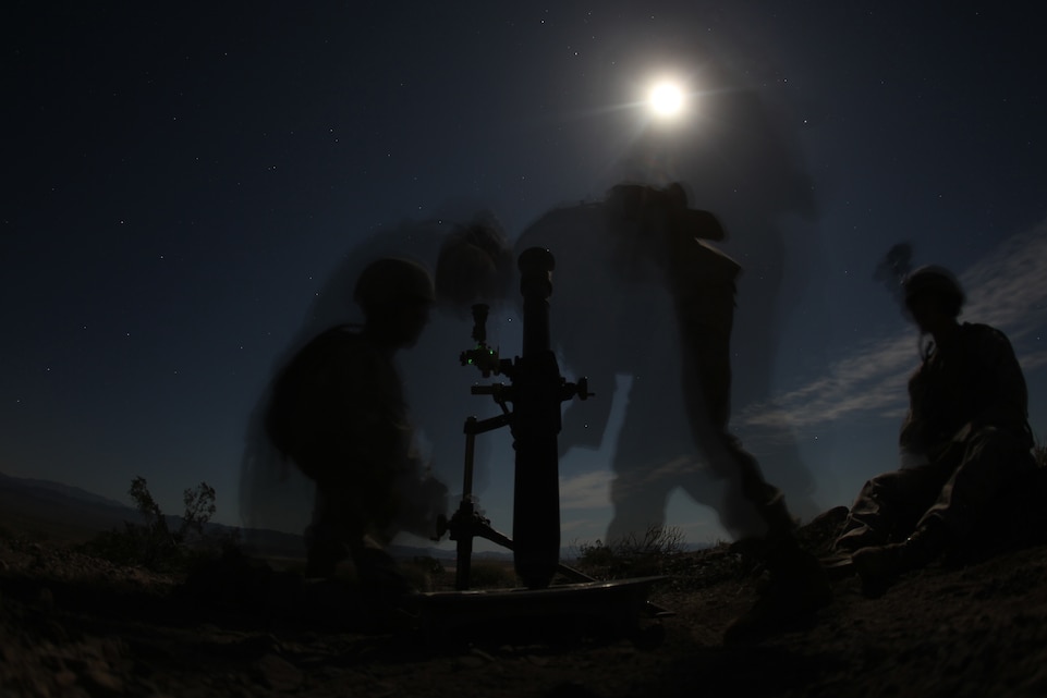 Marines with Weapons Company, Battalion Landing Team 2nd Battalion, 7th Marine Regiment, practice their nighttime standard operating procedures and gun drills Feb. 15, 2011,  at the Combat Center’s Lead Mountain Training Area. The team is slated to deploy with the 31st Marine Expeditionary Unit this summer.