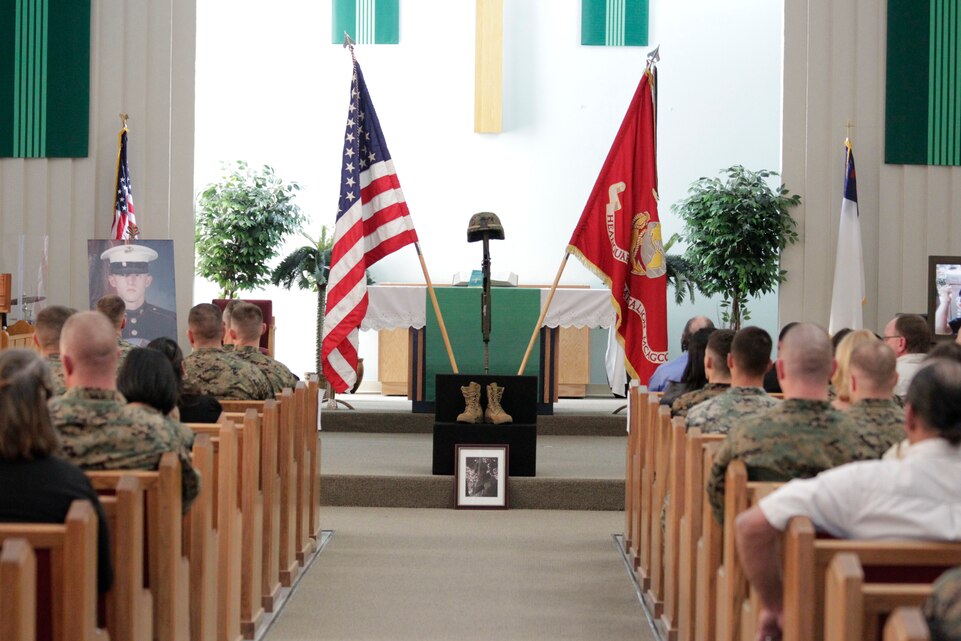A military cross for Cpl. Donald Fowler III rests at the front of the chapel during his memorial service Feb. 15, 2011, at the Protestant Chapel.