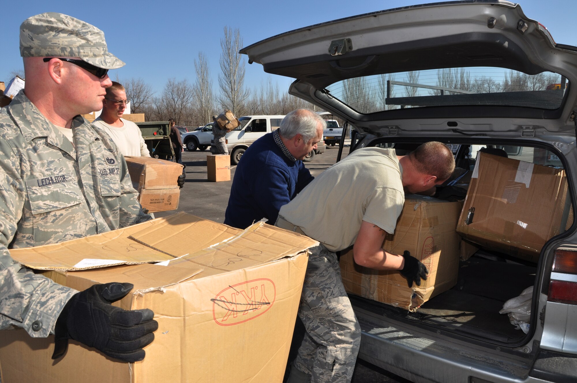 Humanitarian Assistance civil engineers from the Transit Center load donated goods into the van of C. James McCollum from the American Charitable Fund of Scientific Technology and Language Institute in Kyrgyzstan as part of the ongoing humanitarian assistance project Operation Warm & Dry II Feb. 15. Donated goods consisting of clothes, toys, linens and other miscellaneous household goods came from RAF Mildenhall, United Kingdom, Yokota Air Base, Japan, and various parts of the United States. Other NGOs such as Crosslink Development International and Central Asian Partnership collected the goods for their causes as well. This latest round distributed 4,000 lbs of the humanitarian aid to areas including Bishkek and Karakol. (U.S. Air Force photo/Master Sgt. Daniel Nathaniel III)