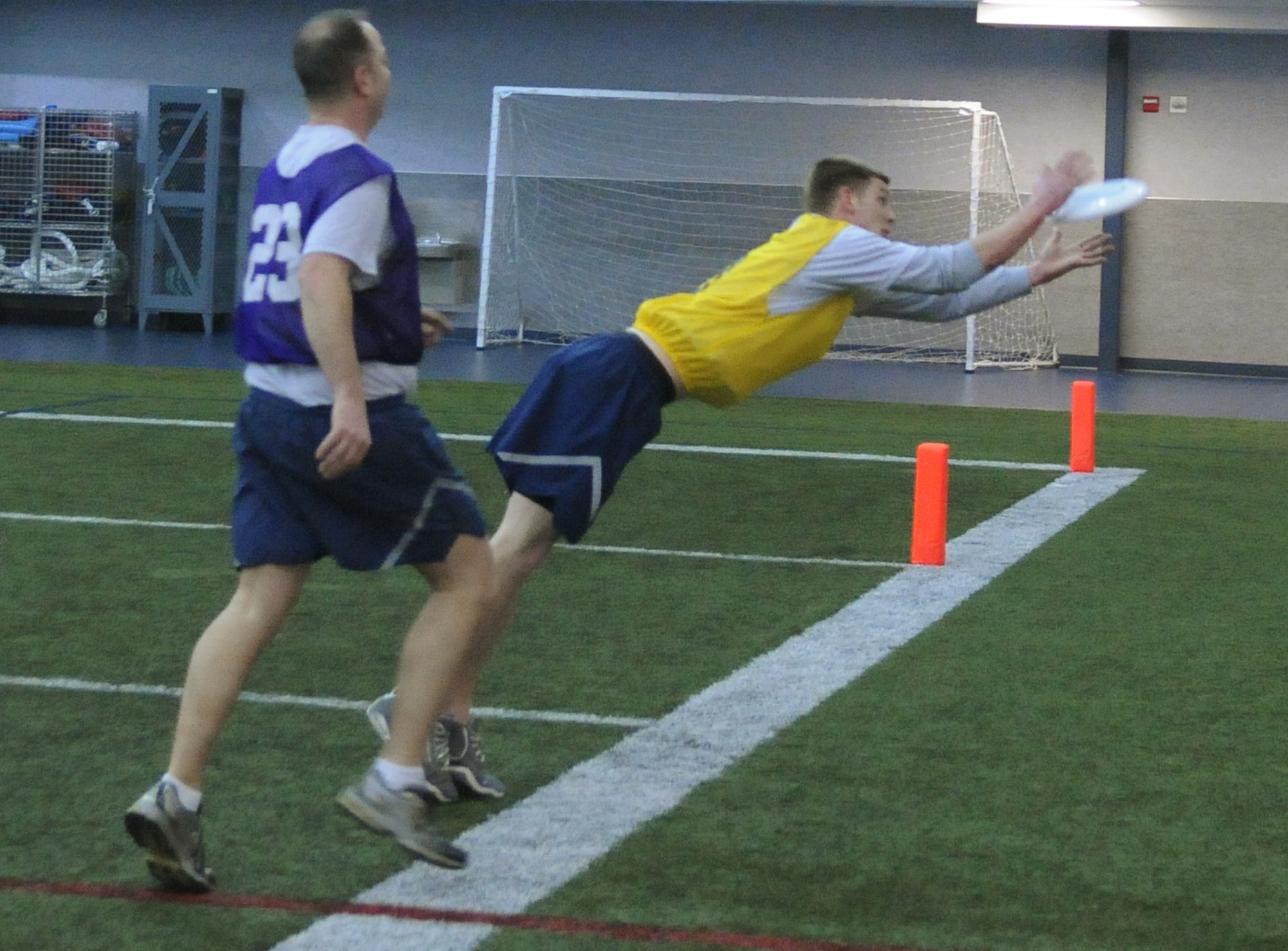 Staff Sgt. Jack Ruen lunges for the frisbee during a game of Ultimate Frisbee Feb. 11, 2011, Eielson Air Force Base, Alaska. Airmen can participate in a variety of sports for Fit Flag. Sergeant Ruen is a 354th Maintenance Squadron propulsion flight aerospace propulsion technician. (U.S. Air Force photo/Airman 1st Class Janine Thibault)