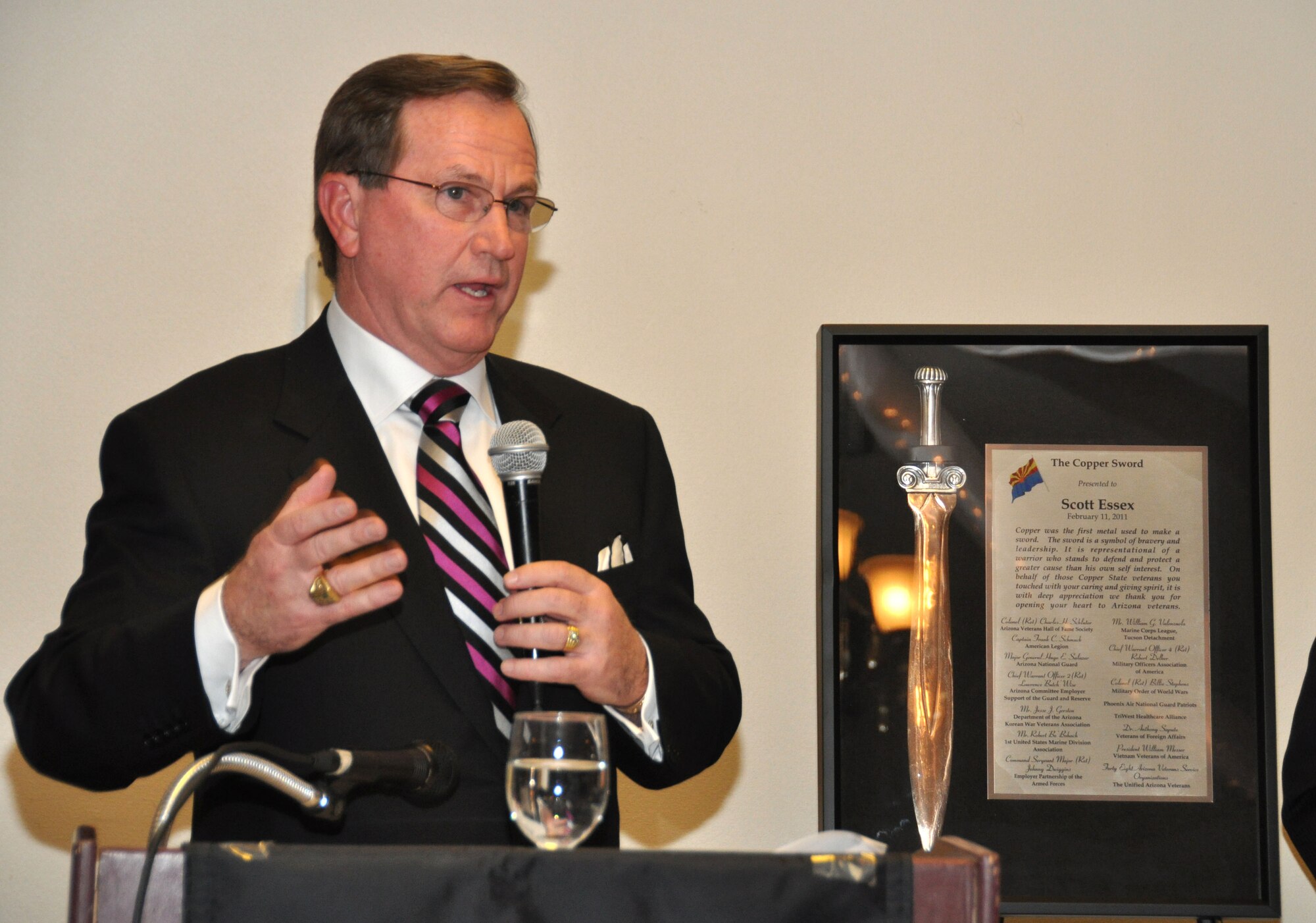 Scott Essex, chairman of the Arizona Office of Employer Support of the Guard and Reserve, accepts the 2011 Copper Sword Award from the Arizona Veterans Hall of Fame Society Feb. 11 in Mesa, Ariz. The Copper Sword, presented to deserving civilian volunteers, represents the first metal swords ever made and symbolizes leadership and the determination to defend a greater cause. (U.S. Army photo by Sgt. Ed Balaban)