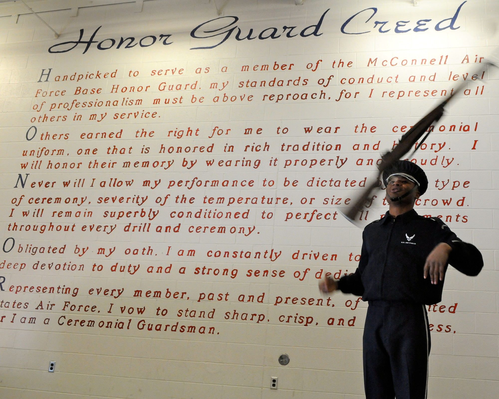 Senior Airman Doyle Boyd, member of The U.S. Air Force Honor Guard drill team, demonstrates drill movements Feb. 14 for the McConnell AFB base honor guard members in Kansas. The drill team travels to bases around the U.S. to perform for Airmen. (U.S. Air Force photo by Airman 1st Class Tabitha N. Haynes)
