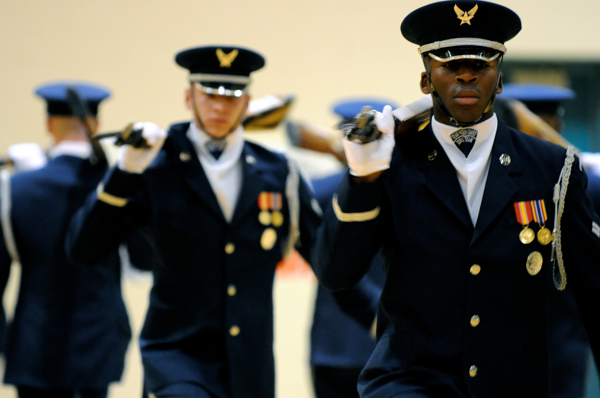 Airman 1st Class Jimmie Pryor, member of The U.S. Air Force Honor Guard drill team, performs Feb. 14 at Derby High School in Derby, Kan. The team performs for local communities and Air Force bases across the U.S. displaying the excellence performed daily by Airmen around the world. (U.S. Air Force photo by Airman 1st Class Tabitha N. Haynes)