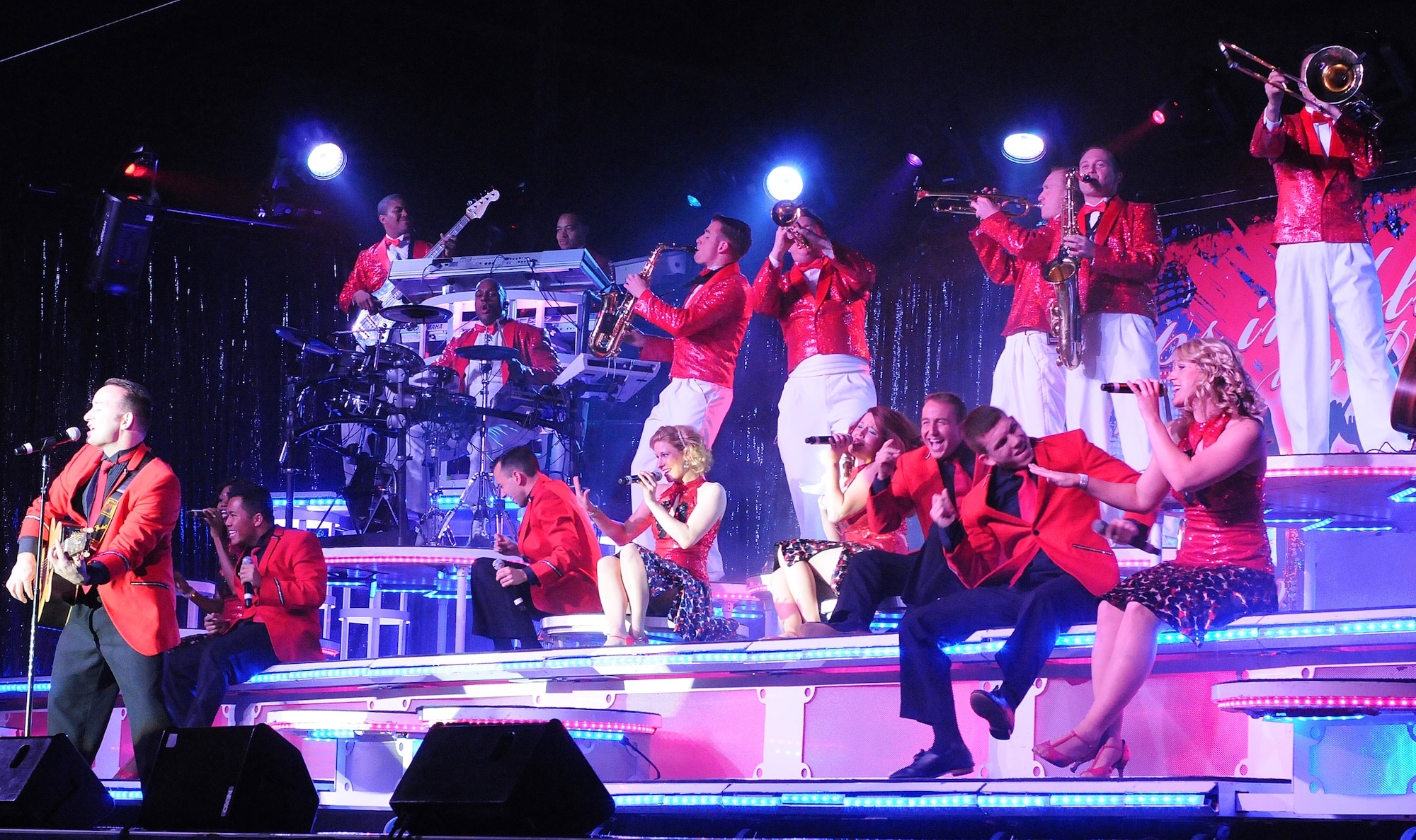 Tops in Blue performers entertain a crowd with an upbeat melody during a show Feb. 12 at Joint Base Lewis-McChord, Wash. (U.S. Army photo/Rick Wood)