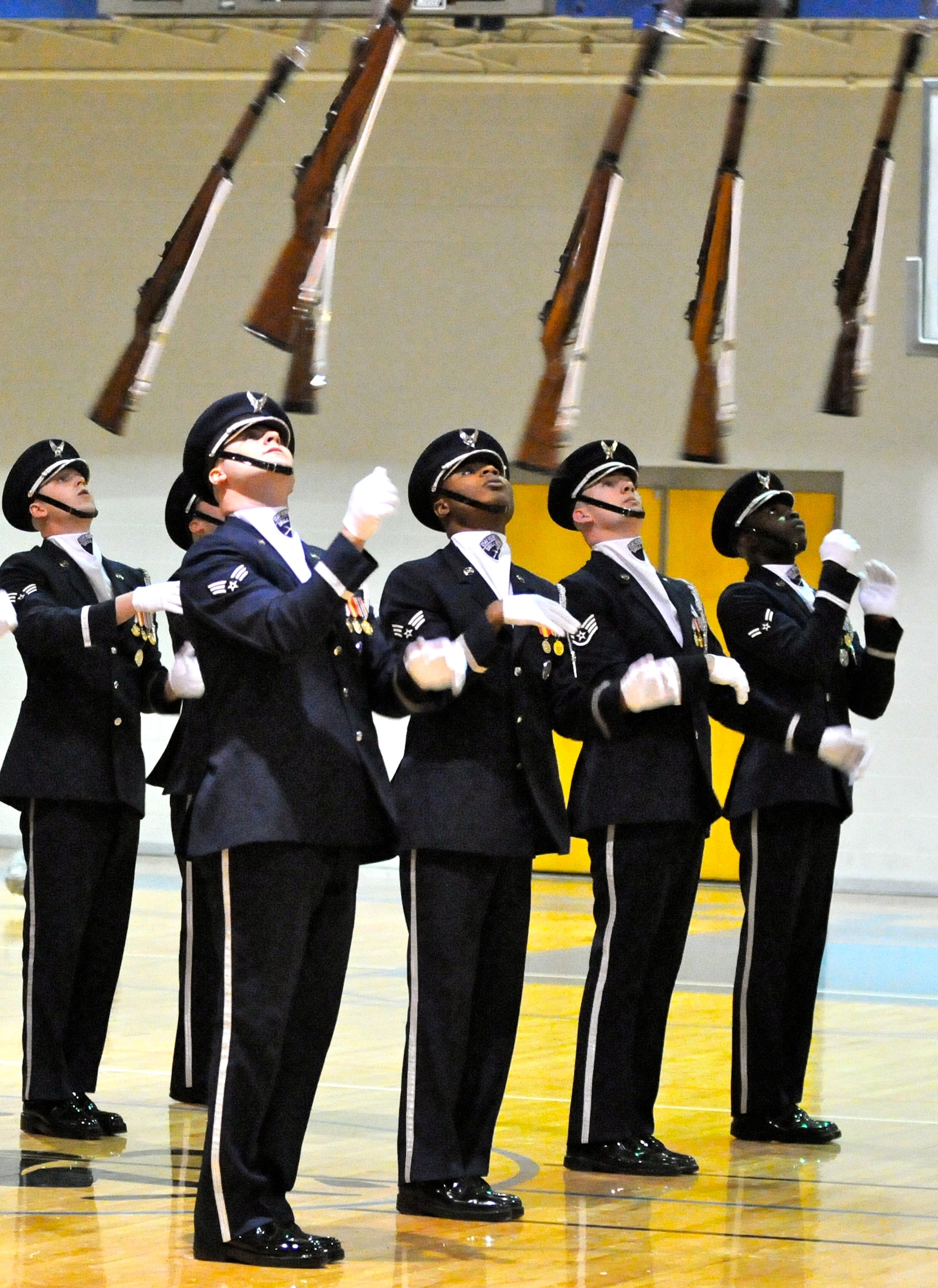 Members of the U.S. Air Force Honor Guard drill team perform for Airmen and youth Feb. 14 at McConnell AFB in Kansas. The drill team performs to represent the Airmen serving around the world in the Air Force. (U.S. Air Force photo by Airman 1st Class Tabitha N. Haynes)