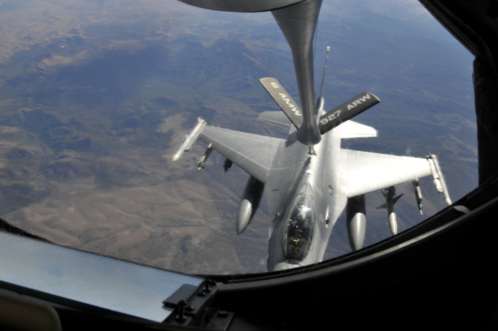 A KC-135 Stratotanker and aircrew from the 91st Air Refueling Squadron at MacDill Air Force Base, Fla., refuels a Royal Netherlands Air Force F-16 Oct. 22, 2009, during a Red Flag 10-1 mission over the Nevada Test and Training Range. Members of the Air Force's fuel efficiency office plan to host their first service-wide Aviation Operations Energy Steering Group summit at Scott AFB, Ill., on Feb. 16 and 17, 2011. (U.S. Air Force photo/Tech. Sgt. Chris Stagner)