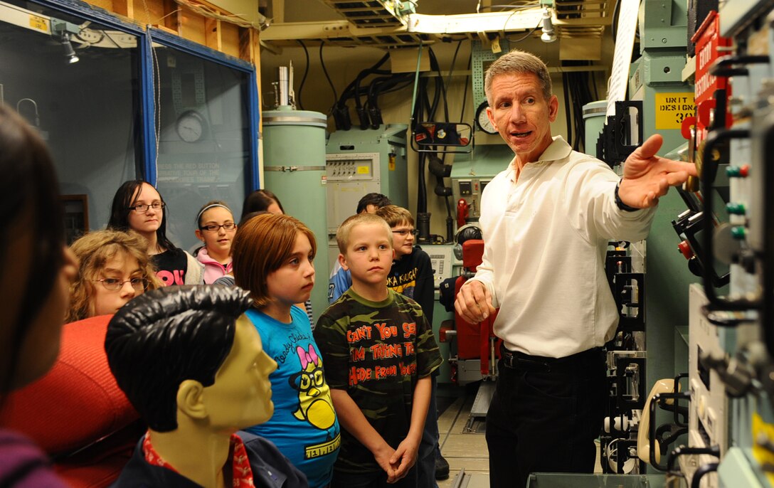 Carl Engwall, South Dakota Air and Space Museum director, gives fifth graders a tour of a missile alert facility exhibit during a STARBASE visit at the South Dakota Air and Space Museum, Feb. 11, 2011. STARBASE is a Department of Defense program designed to raise interest and improve knowledge and skills of at-risk youth in science, technology, engineering and mathematics. (U.S. Air Force photo/Senior Airman Kasey Close)