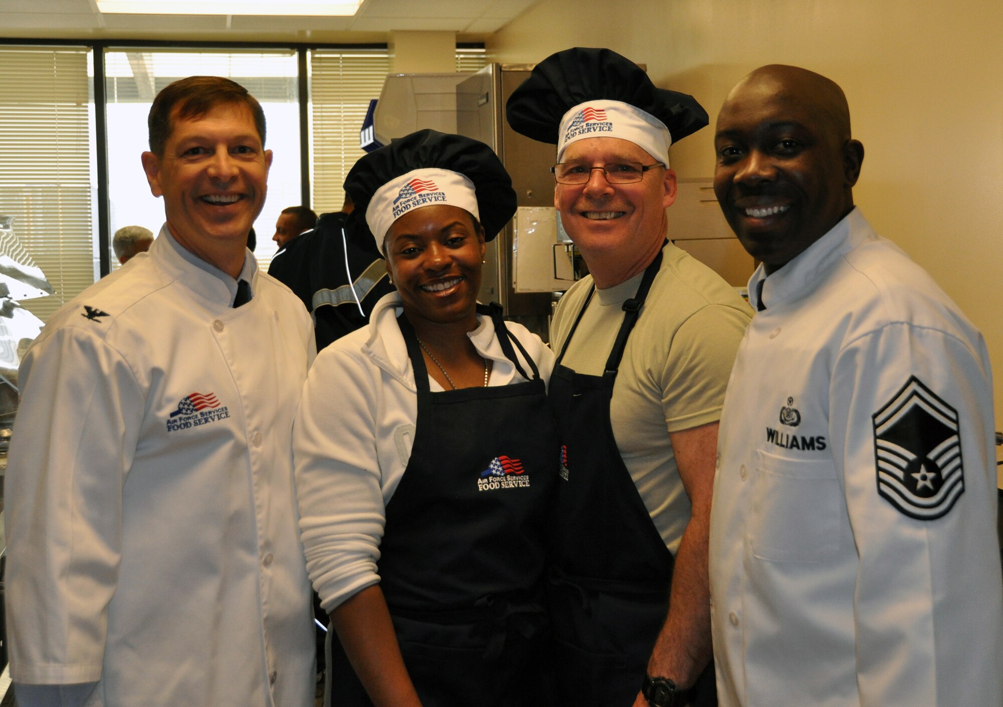 Col. Thomas C. Joyce, Air Force Mortuary Affairs Operations commander dons
his chef coat and poses with Master Sgt. Yolaunda Vera Cruz, Senior Master
Sgt.  Mark Lounello and Senior Master Sgt. Tyrone Williams during a
Valentine's Breakfast the Top 3 hosted at the Charles C. Carson Center for
Mortuary Affairs Feb. 14, 2011. Senior NCOs from AFMAO teamed up to cook and
serve breakfast for the staff here. (U.S. Air Force photo/Christin Michaud)
