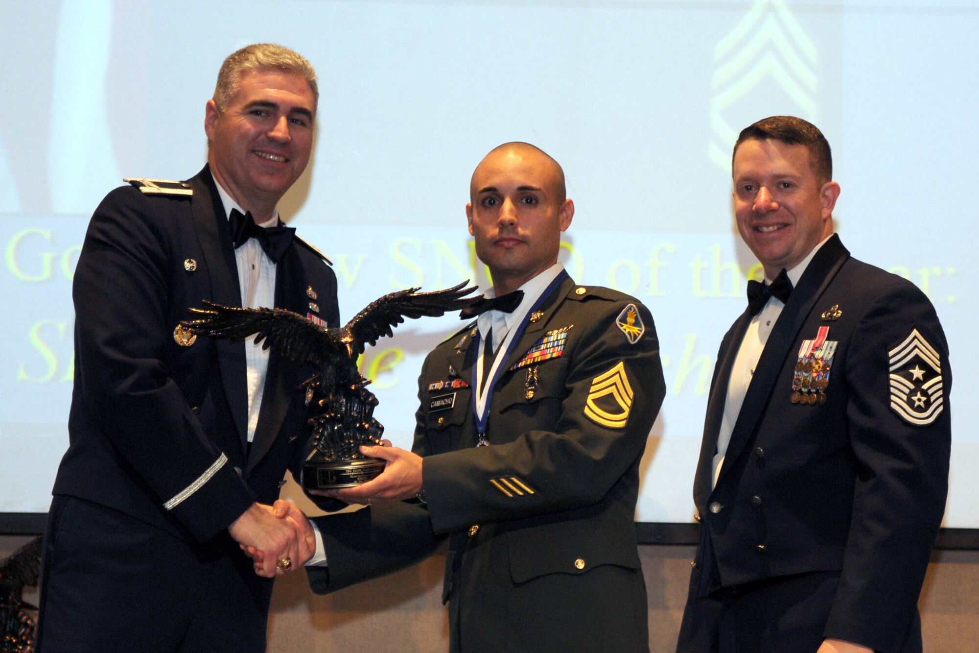 GOODFELLOW AIR FORCE BASE, Texas - Petty Officer 1st Class William Sum, Navy Center for Information Dominance Detachment, receives the Sailor of the Year Award during the Annual Awards ceremony at the McNease Convention Center, San Angelo, Texas, Feb. 11, 2011. (U.S. Air Force photo/Staff Sgt. Heather Rodgers)