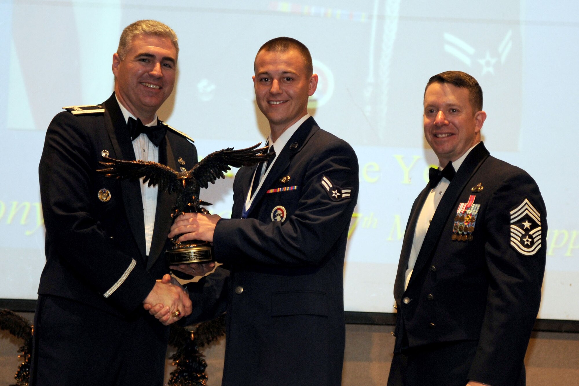 GOODFELLOW AIR FORCE BASE, Texas - Airman 1st Class Anthony Gerspacher, 17th Mission Support Group, receives the Honor Guard Member of the Year Annual Award during the ceremony at the McNease Convention Center, San Angelo, Texas, Feb. 11, 2011. (U.S. Air Force photo/Staff Sgt. Heather Rodgers)

