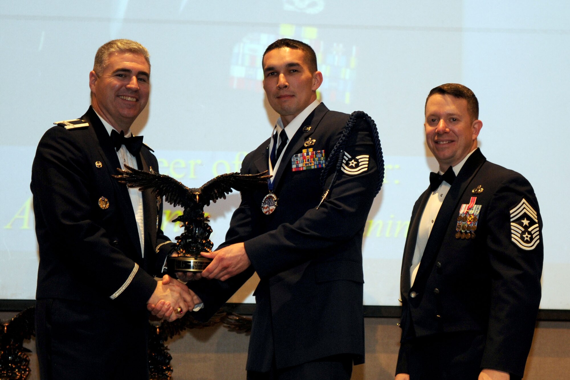 GOODFELLOW AIR FORCE BASE, Texas - Tech. Sgt. Alan Vong, 517th Training Group, receives the Volunteer of the Year Annual Award during the ceremony at the McNease Convention Center, San Angelo, Feb. 11, 2011. (U.S. Air Force photo/Staff Sgt. Heather Rodgers)