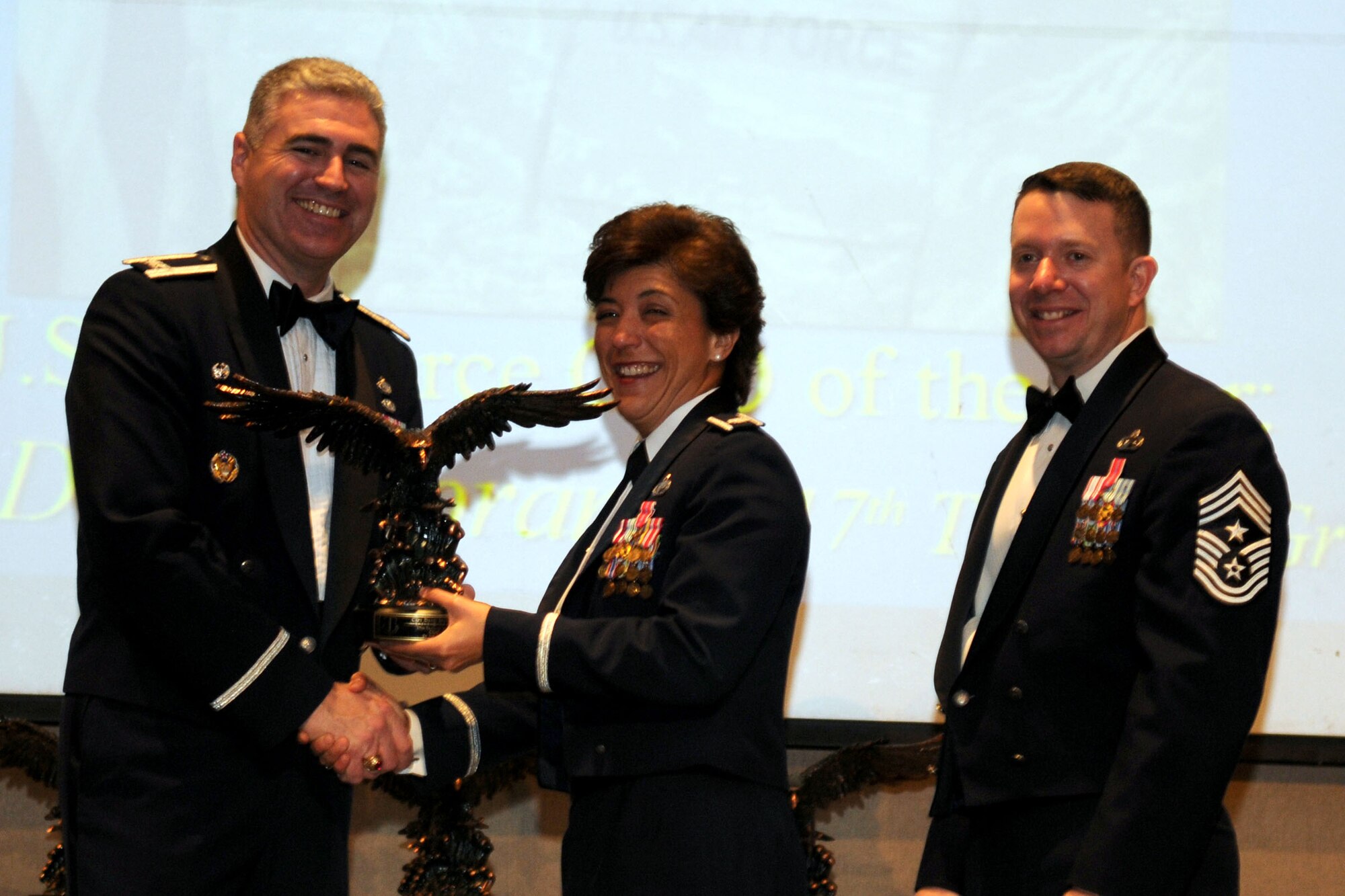 GOODFELLOW AIR FORCE BASE, Texas - Lt. Col. Karen Rolirad, 315th Training Squadron Commander receives the Company Grade Officer Annual Award on behalf of Capt. David Morandi, 17th Training Group during the ceremony at the McNease Convention Center, San Angelo, Texas, Feb. 11, 2011. (U.S. Air Force photo/Staff Sgt. Heather Rodgers)