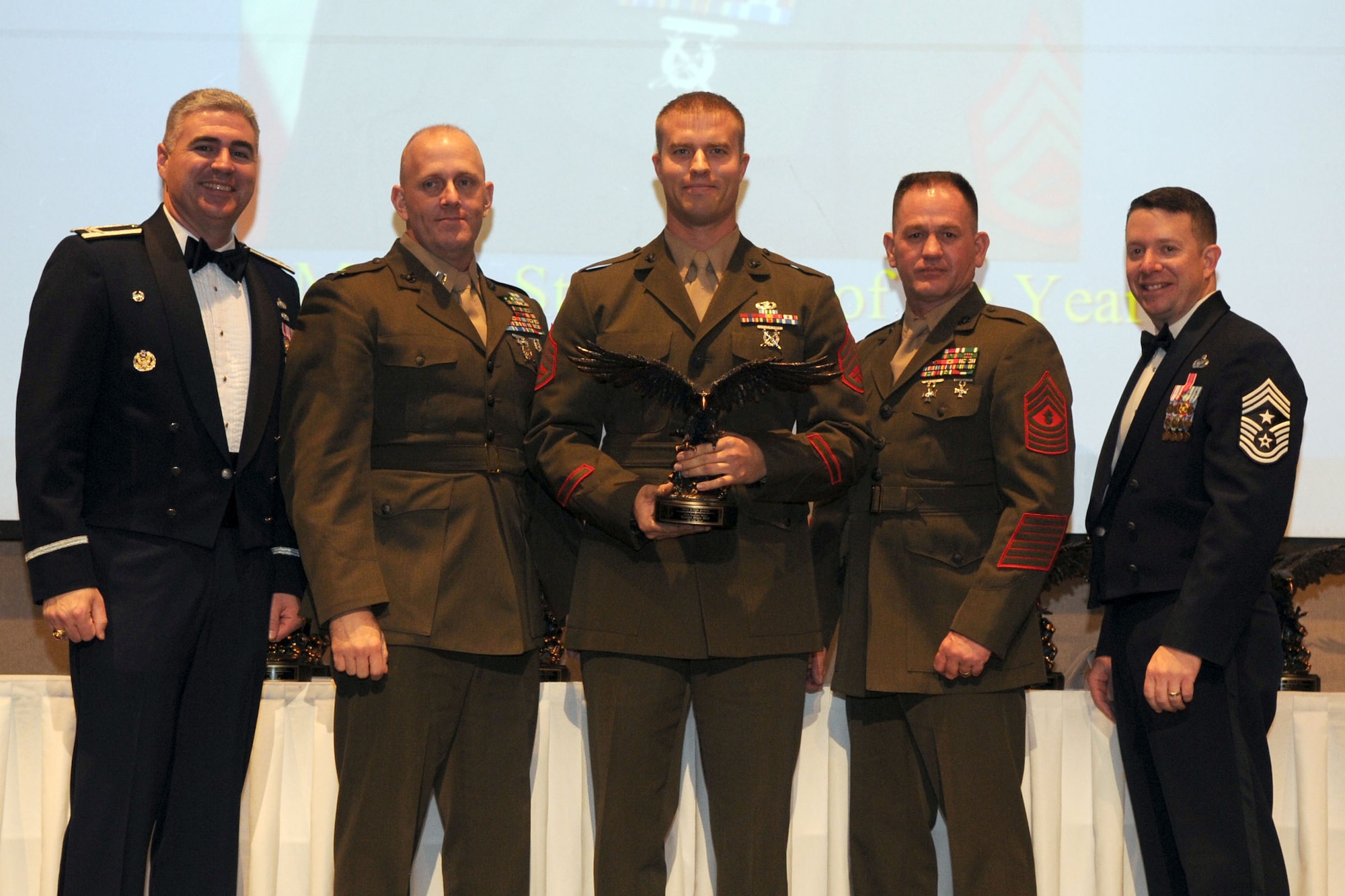 GOODFELLOW AIR FORCE BASE, Texas - Marine Staff Sgt. Justin Jenson, Marine Corps Detachment, receives the Staff Noncommissioned Officer of the Year award during the Annual Awards ceremony, at the McNease Convention Center, San Angelo, Feb. 11, 2011. (U.S. Air Force photo/Staff Sgt. Heather Rodgers)