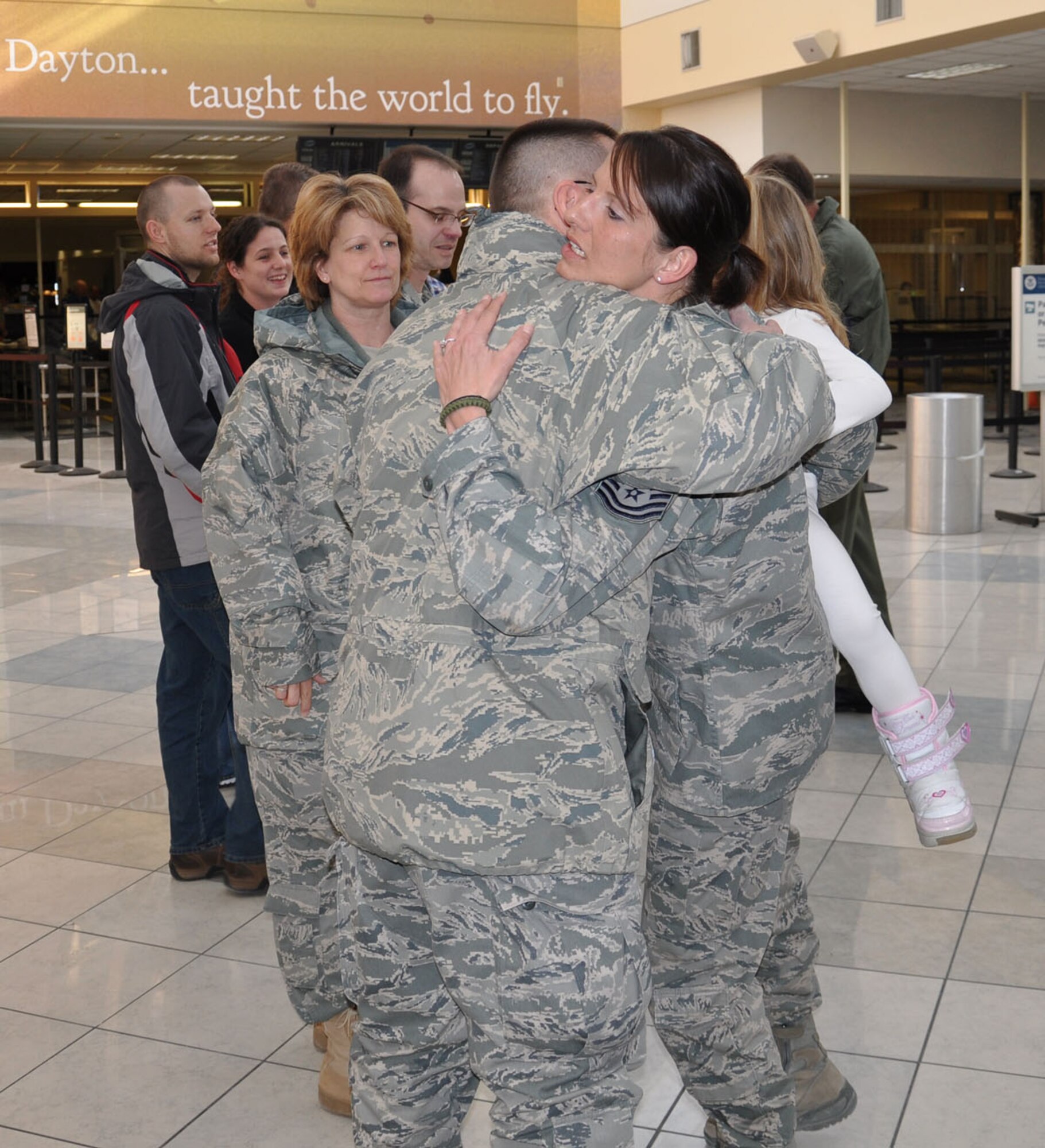 WRIGHT-PATTERSON AIR FORCE BASE, Ohio – Tech. Sgt. Leslie Lovegrove, 87th Aerial Port Squadron, receives a hug from Tech. Sgt. Larry Moorman, 87 APS, upon her arrival at the Dayton International Airport Feb. 11 after returning from a 4-month deployment to Joint Base Balad.  (U.S. Air Force photo/Lt. Col. Cynthia Harris)