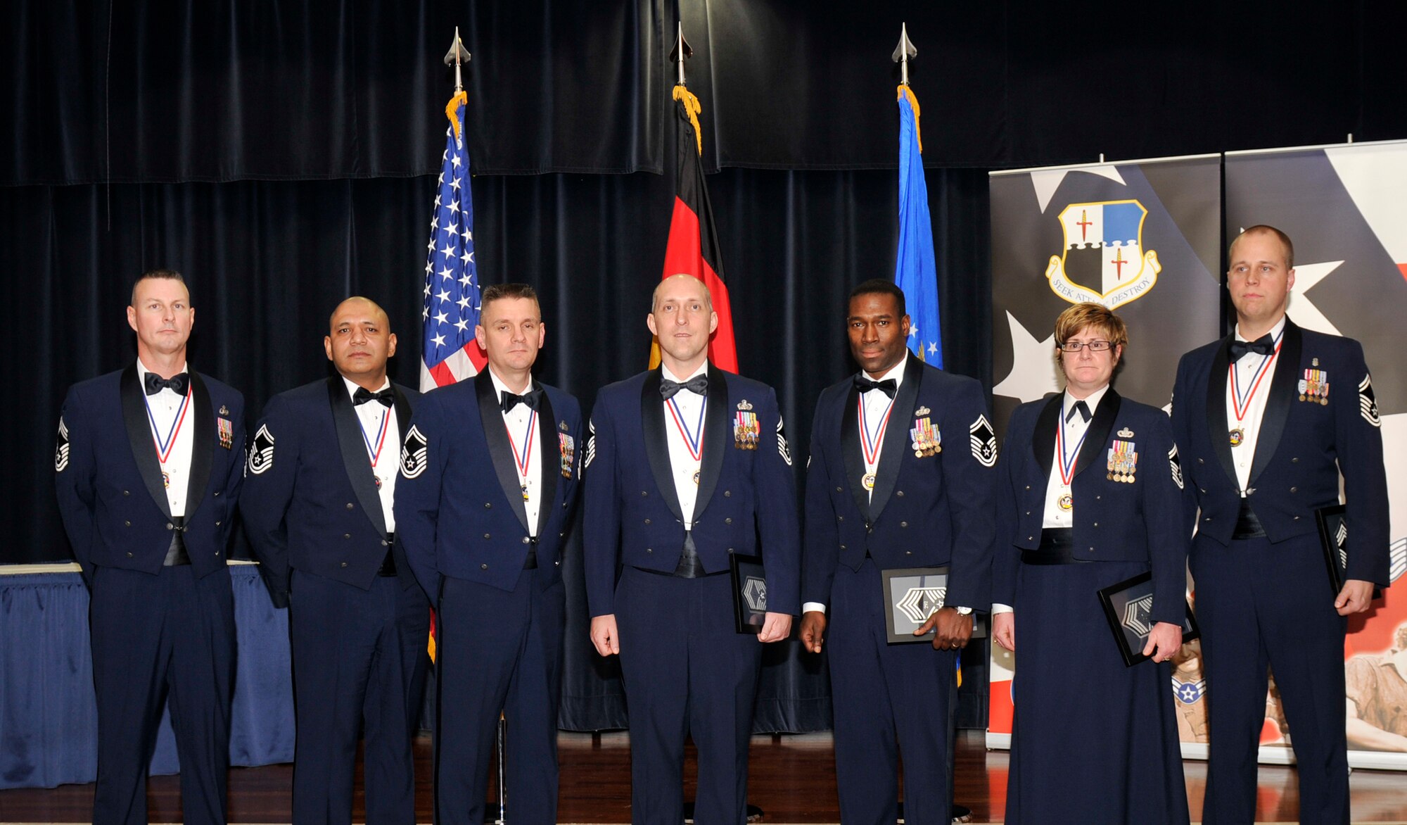 SPANGDAHLEM AIR BASE, Germany – Seven new 52nd Fighter Wing chief master sergeant selects pose for a group photo at the Chiefs Recognition Ceremony at Club Eifel Feb. 11. The selectees were, from left to right, Chief Master Sgt. Dion Cawthon, 52nd Operation Support Squadron; and Senior Master Sgts. Robert Tejada, 52nd Medical Support Squadron; Roderick Cornett, 701st Munitions Support Squadron; David Polich, 52nd Communications Squadron; Robert Lovett, 52nd Civil Engineer Squadron; Melissa Permar, 703rd Munitions Support Squadron; and Christopher Lantagne 52nd MDSS. (U.S. Air Force photo/Airman 1st Class Brittney Frees)