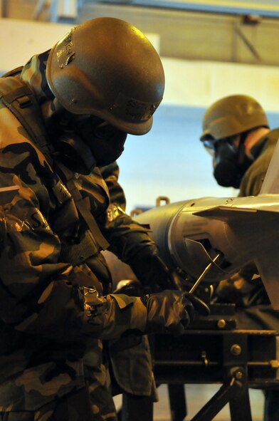 MINOT AIR FORCE BASE, N.D. – Staff Sgt. Derek Ferch, 5th Munitions Squadron maintenance crew member, helps assemble unguided bombs at the conventional maintenance shop here Feb. 11. Conventional maintenance crew members are evaluated while assembling bombs to meet armor load standardizations to support the 23rd and 69th Bomb Squadrons. (U.S. Air Force photo/Airman 1st Class Jessica McConnell)