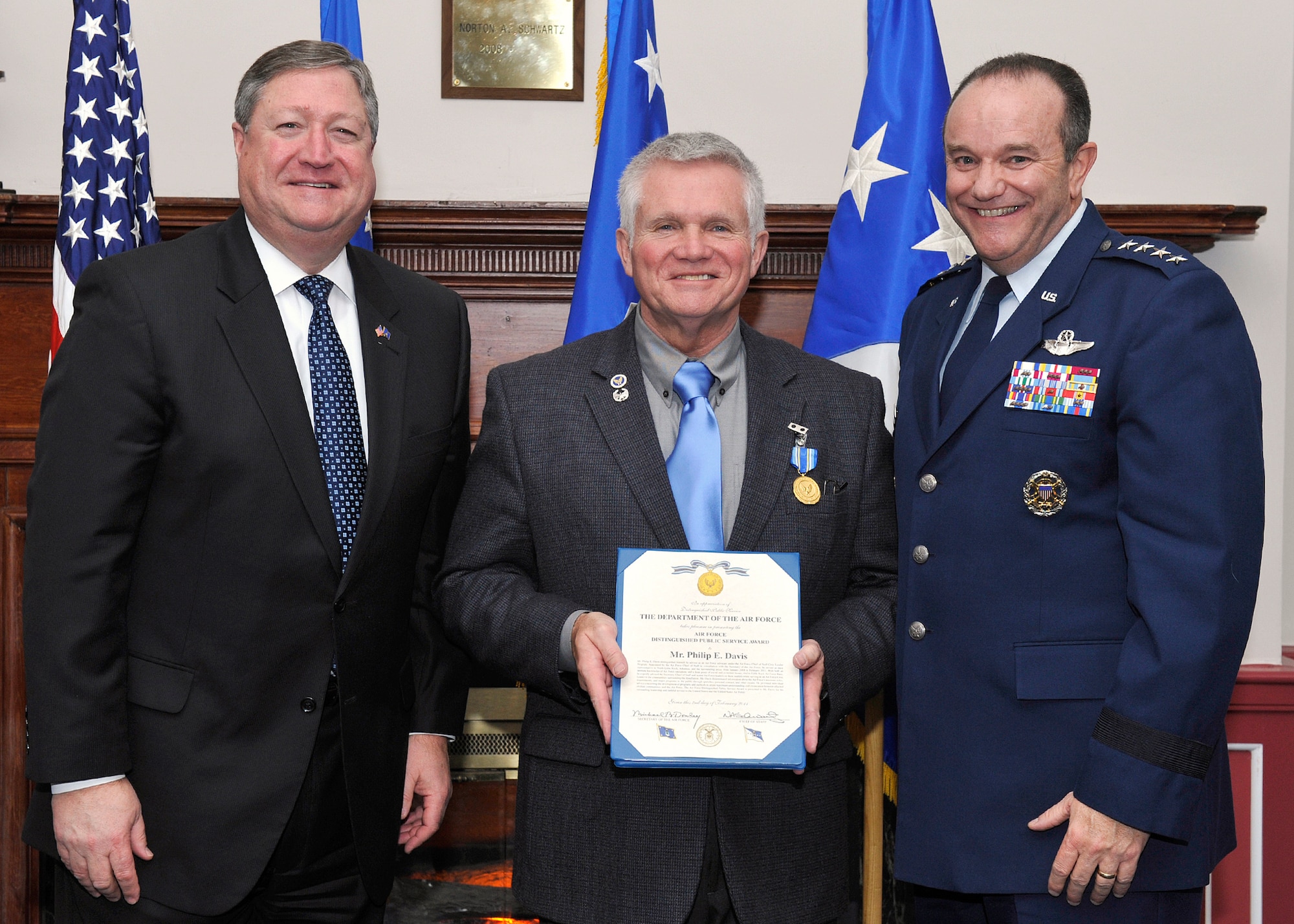 Michael Donley, Secretary of the Air Force, and Gen. Phillip Breedlove, Air Force Vice Chief of Staff, presented the Air Force Distinguished Public Service Award to Mr. Phil Davis during a dinner in honor of the Air Force Chief of Staff Civic Leaders Feb. 2, 2001, at Joint Base Anacostia-Bolling.  (U.S. Air Force photo/Michael J Pausic)  