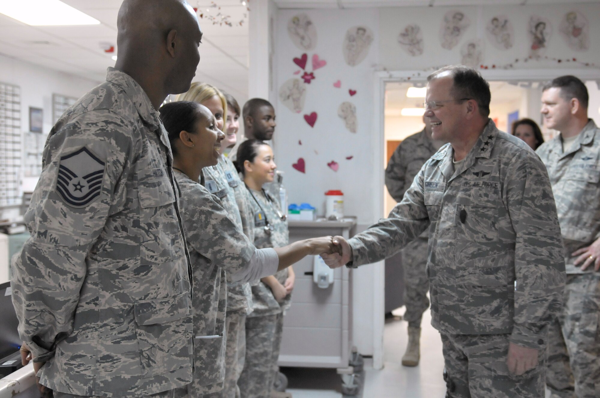 Air Force Surgeon General Lt. Gen. (Dr.) Charles B. Green meet members of the 455th Expeditionary Medical Group at the Craig Joint Theater Hospital, Bagram Airfield, Afghanistan, Feb. 13, 2011. General Green was joined by U.S. Navy Vice Adm. Adam M. Robinson Jr.  and U.S. Army Lt. Gen. Eric B. Schoomaker during the visit which allowed them the opportunity to look at ways of helping medics operating day-in and day-out in the field to achieve more inoperability and ensure they had the necessary resources to provide the best care possible. (U.S. Air Force photo by Tech. Sgt. Michael Voss)