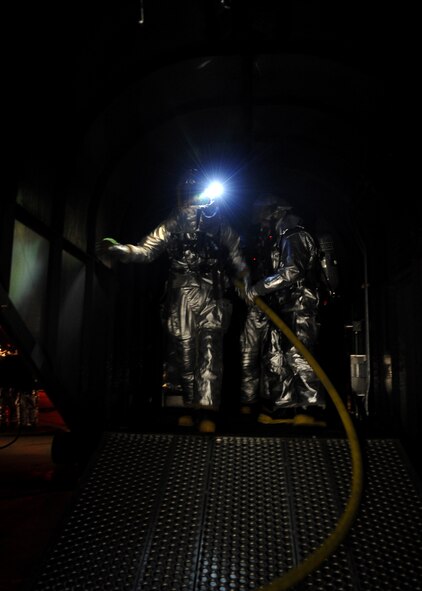 The 51st Civil Engineer Squadron firefighter department and 51st Medical Group respond to a simulated aircraft fire during Operational Readiness Exercise Beverly Midnight 11-01 at Osan Feb. 14. The exercise allows Airmen to demonstrate their ability to complete the mission in simulated chemical environments while executing their primary duties, practicing self aid and buddy care, conduction post-attack reconnaissance and unexploded ordnance sweeps (U.S. Air Force photos/Senior Airman Evelyn Chavez).