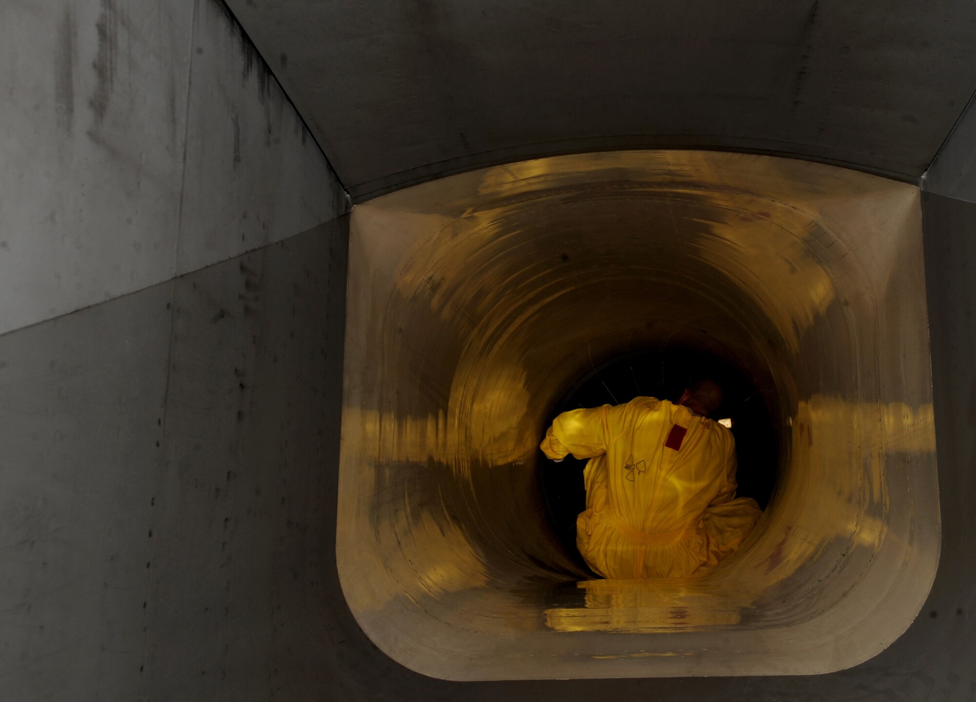 A member from the 380th Expeditionary Aircraft Maintenance Squadron, checks for any damage inside an F-15C Eagle?s engine intake recently. The 67th Expeditionary Fighter Squadron currently flies the F-15C Eagle and is deployed from Kadena AFB, Japan. (U.S. Air Force photo by Senior Airman Maynelinne De La Cruz) 
