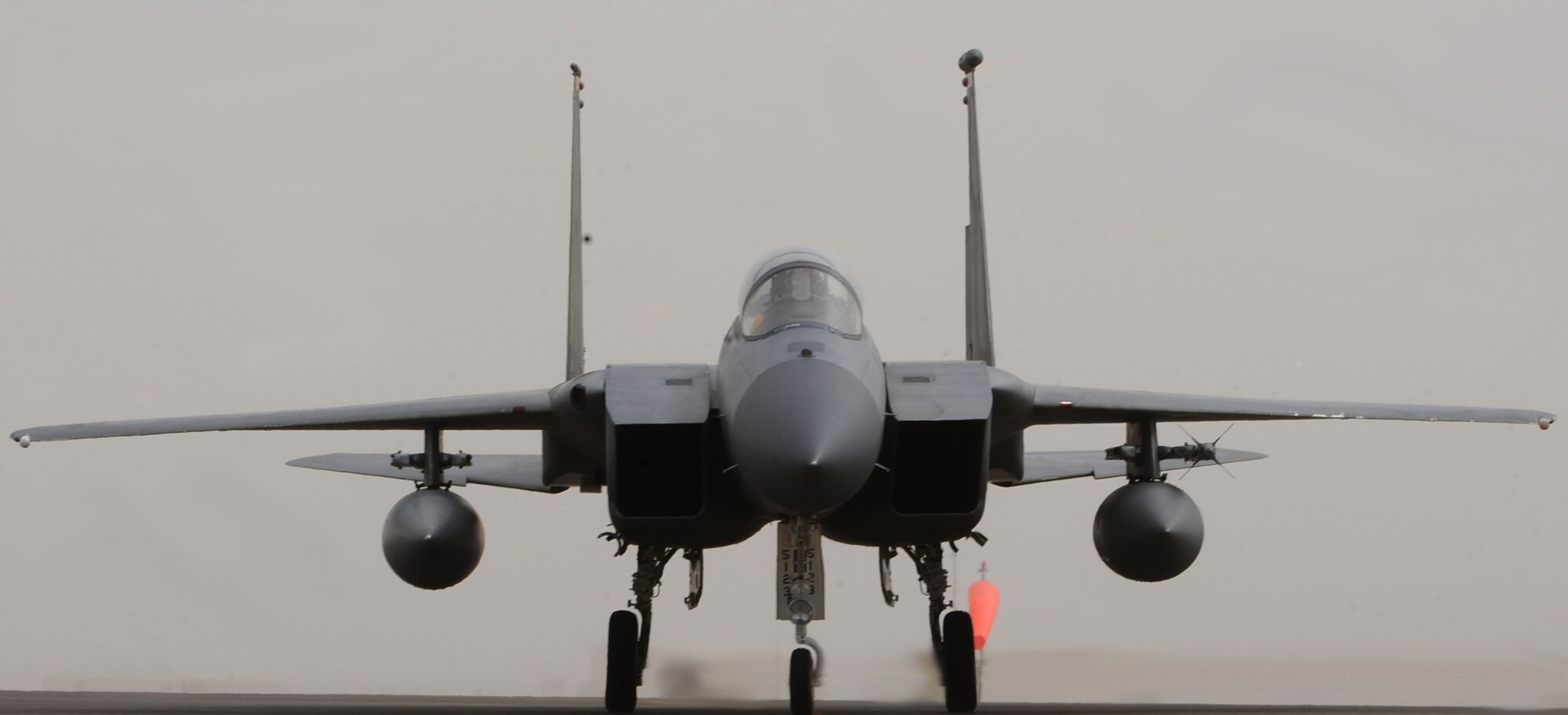 One of several newly arrived F-15C Eagle aircrafts taxies down a runway recently in Southwest Asia. The 67th Expeditionary Fighter Squadron currently flies the F-15C Eagle and is deployed from Kadena AFB, Japan. (U.S. Air Force photo illustration by Senior Airman Maynelinne De La Cruz)