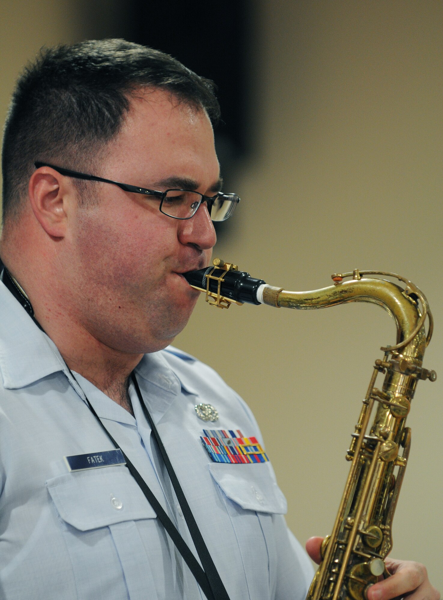 MILDENHALL, England -- Staff Sgt. David Fatek, U.S. Air Forces in Europe Band Check Six ensemble, performs a saxophone solo at the Mildenhall Social Club Feb. 13, 2011. The free jazz-inspired concert attracted a crowd that nearly filled the facility to capacity. (U.S. Air Force photo/Staff Sgt. Thomas Trower)