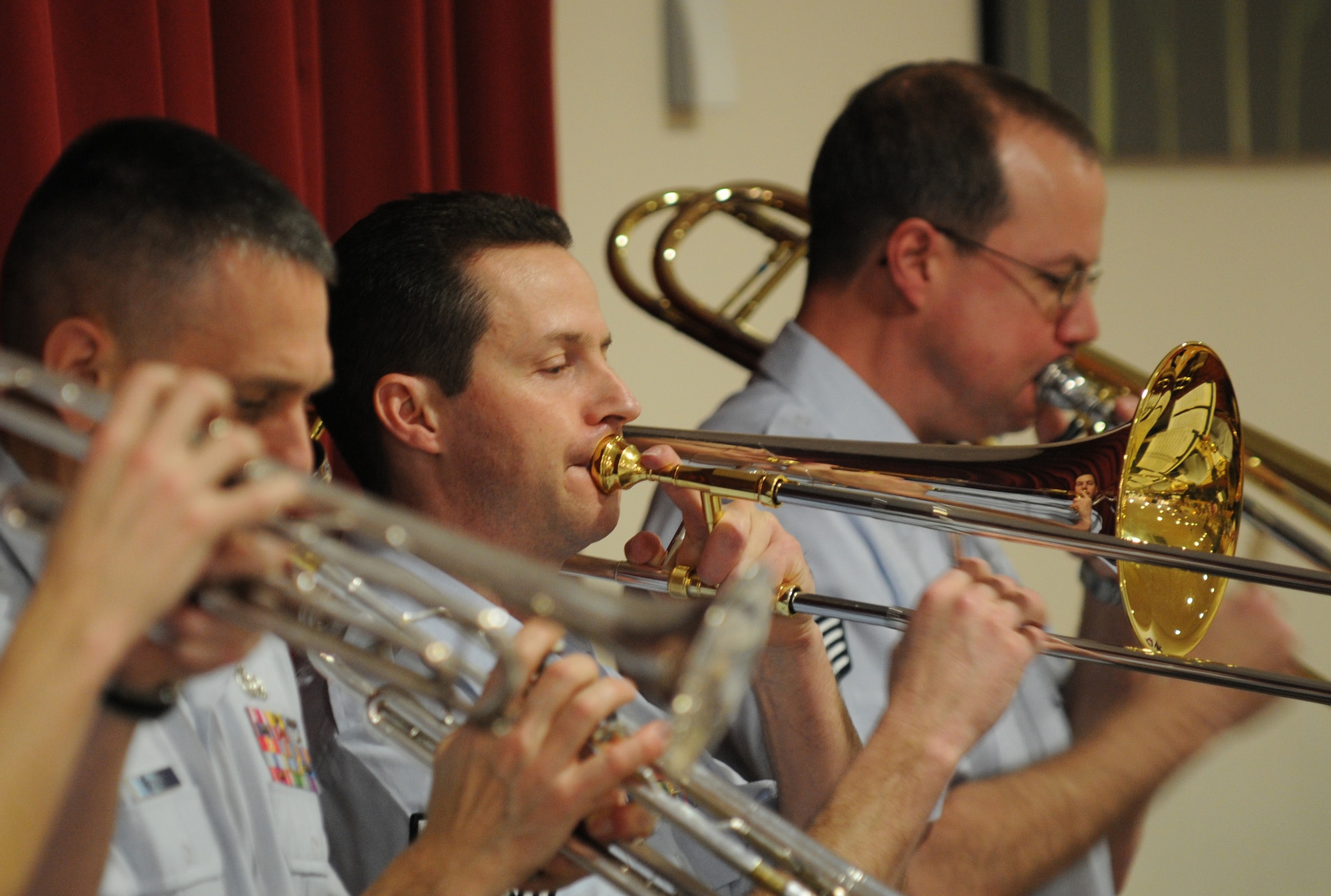 MILDENHALL, England -- Master Sgt. Charles Anderson, trombone player (center), plays the song "Chega de Saudade" with the rest of the U.S. Air Forces in Europe Band Check Six ensemble at the Mildenhall Social Club Feb. 13, 2011. The 13-piece ensemble gave a free jazz-inspired concert to local residents as a way of continually building partnerships and community relations. (U.S. Air Force photo/Staff Sgt. Thomas Trower)