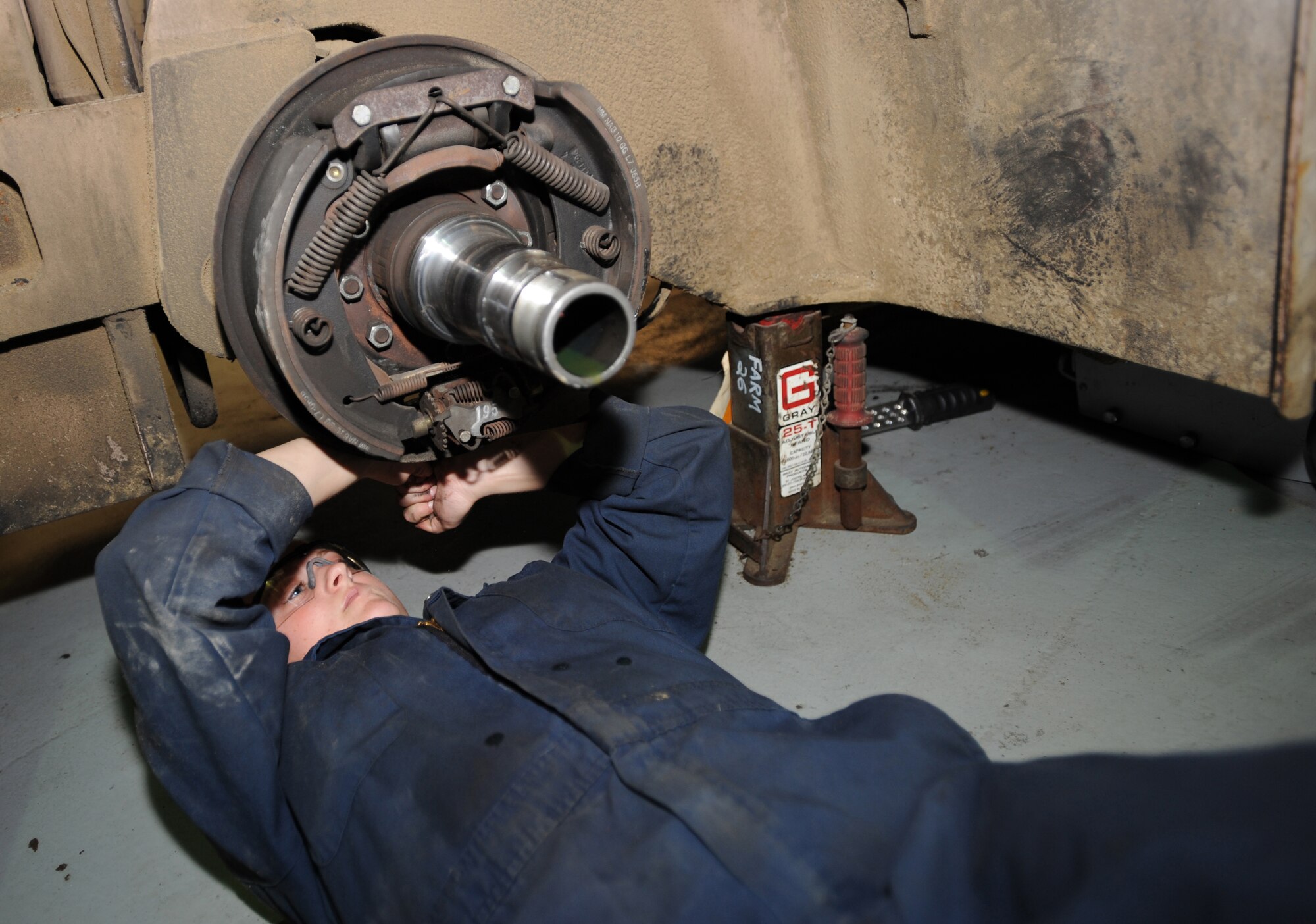 Staff Sgt. Neryssa Adrian, 380th Expeditionary Logistics Readiness Squadron, adjusts the breaks on a forklift Jan. 24, 2011, at the vehicle maintenance shop. The shop generally services around three to five vehicles each day. SSgt. Adrian is deployed here from the 133rd LRS, Minnesota Air National Guard. (U.S. Air Force photo by Senior Airman Maynelinne De La Cruz)