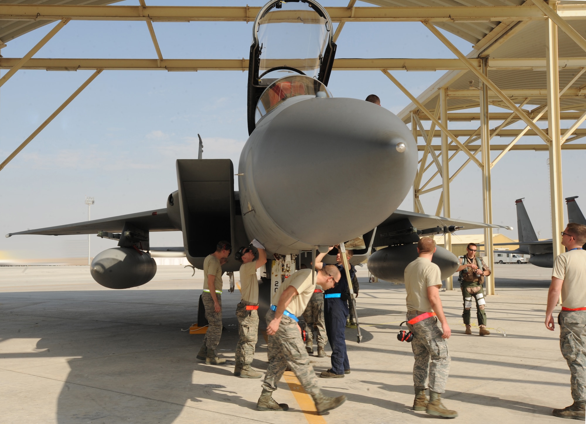 Maintainers from the 380th Expeditionary Aircraft Maintenance Squadron perform maintenance on the 67th Expeditionary Fighter Squadron F-15Cs after arriving in Southwest Asia recently. The 67th EFS is deployed from Kadena AFB, Japan. (U.S. Air Force photo by Senior Airman Maynelinne De La Cruz)