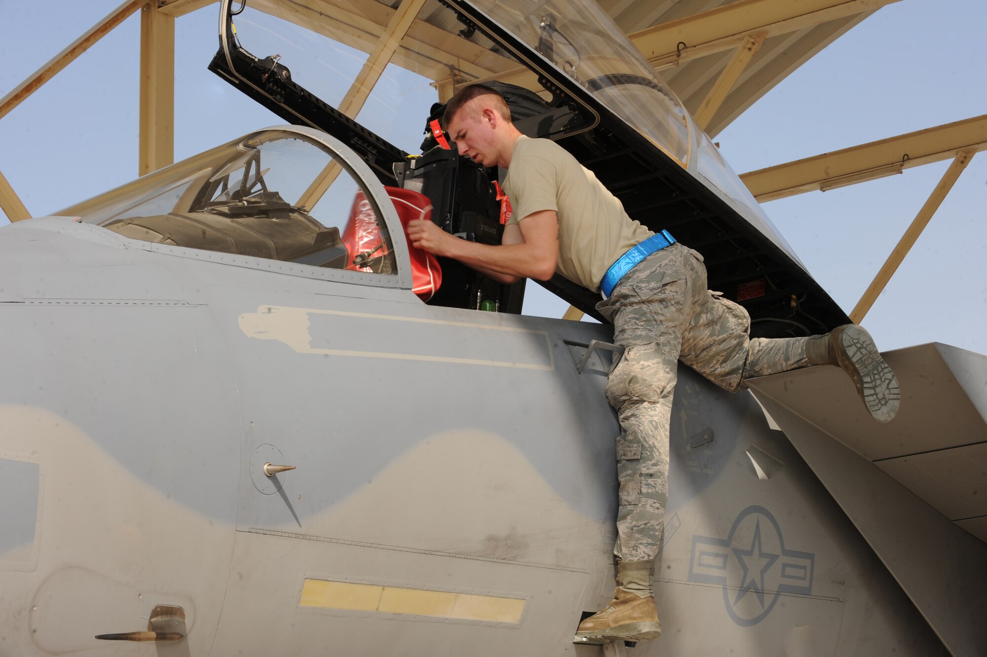 Maintainers from the 380th Expeditionary Aircraft Maintenance Squadron secure the 67th Expeditionary Fighter Squadron's F-15C after it arrived in Southwest Asia recently. The 67th EFS is deployed from Kadena AFB, Japan. (U.S. Air Force photo by Senior Airman Maynelinne De La Cruz)