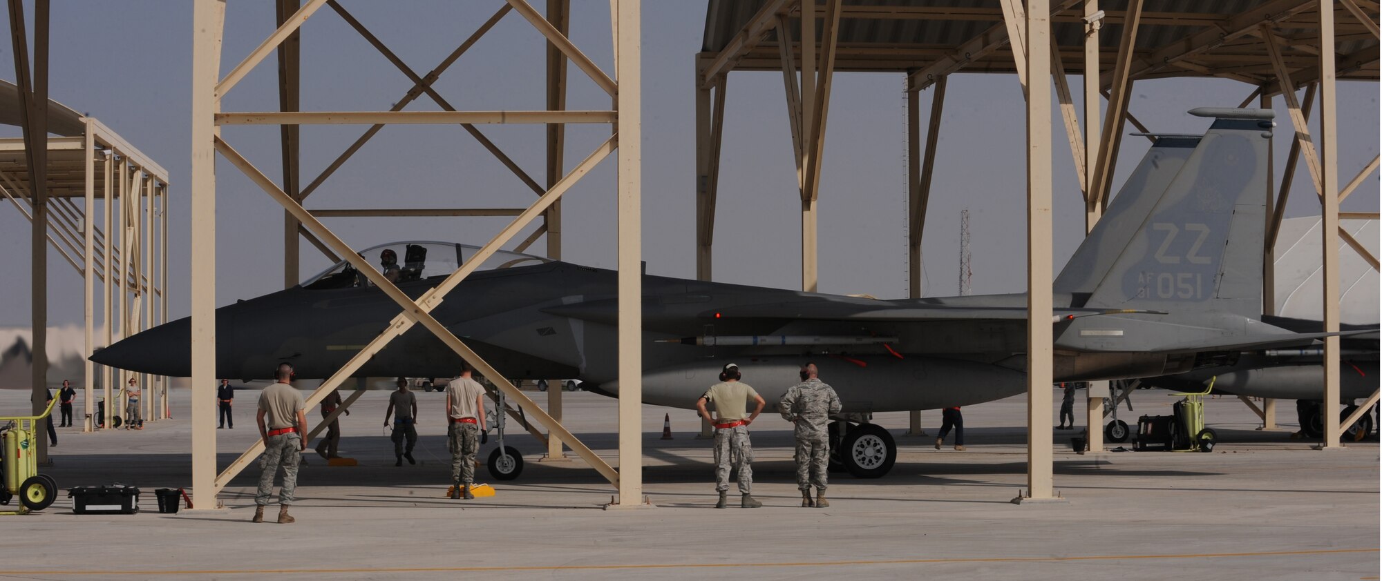 Maintainers from the 380th Expeditionary Aircraft Maintenance Squadron marshal in the 67th Expeditionary Fighter Squadron F-15Cs as they arrived in Southwest Asia recently. The 67th EFS is deployed from Kadena AFB, Japan. (U.S. Air Force photo by Senior Airman Maynelinne De La Cruz)