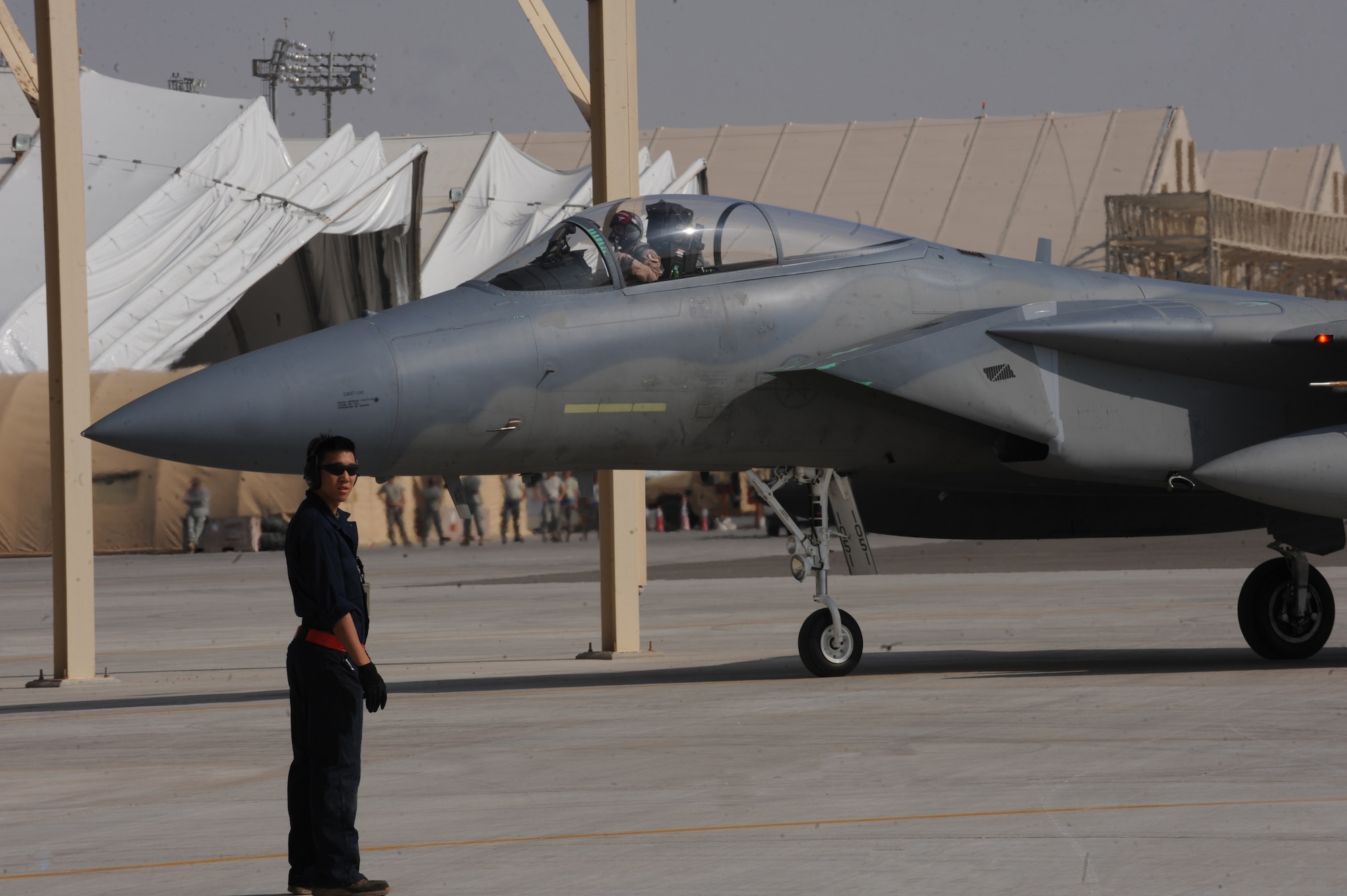Maintainers from the 380th Expeditionary Aircraft Maintenance Squadron marshal in the 67th Expeditionary Fighter Squadron F-15Cs as they arrived in Southwest Asia recently. The 67th EFS is deployed from Kadena AFB, Japan. (U.S. Air Force photo by Senior Airman Maynelinne De La Cruz)