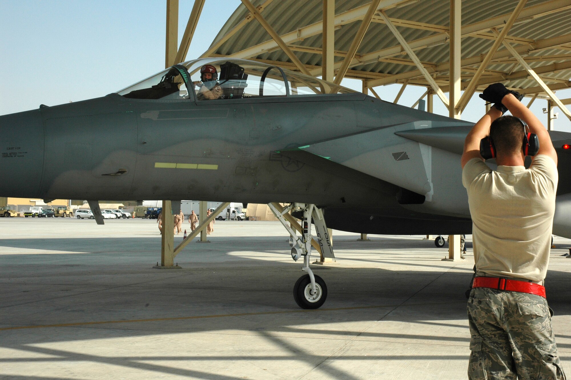 Maintainers from the 380th Expeditionary Aircraft Maintenance Squadron marshal in the 67th Expeditionary Fighter Squadron F-15Cs as they arrived in Southwest Asia recently. The 67th EFS is deployed from Kadena AFB, Japan. (U.S. Air Force photo by Master Sgt. Julie Briden-Garcia)