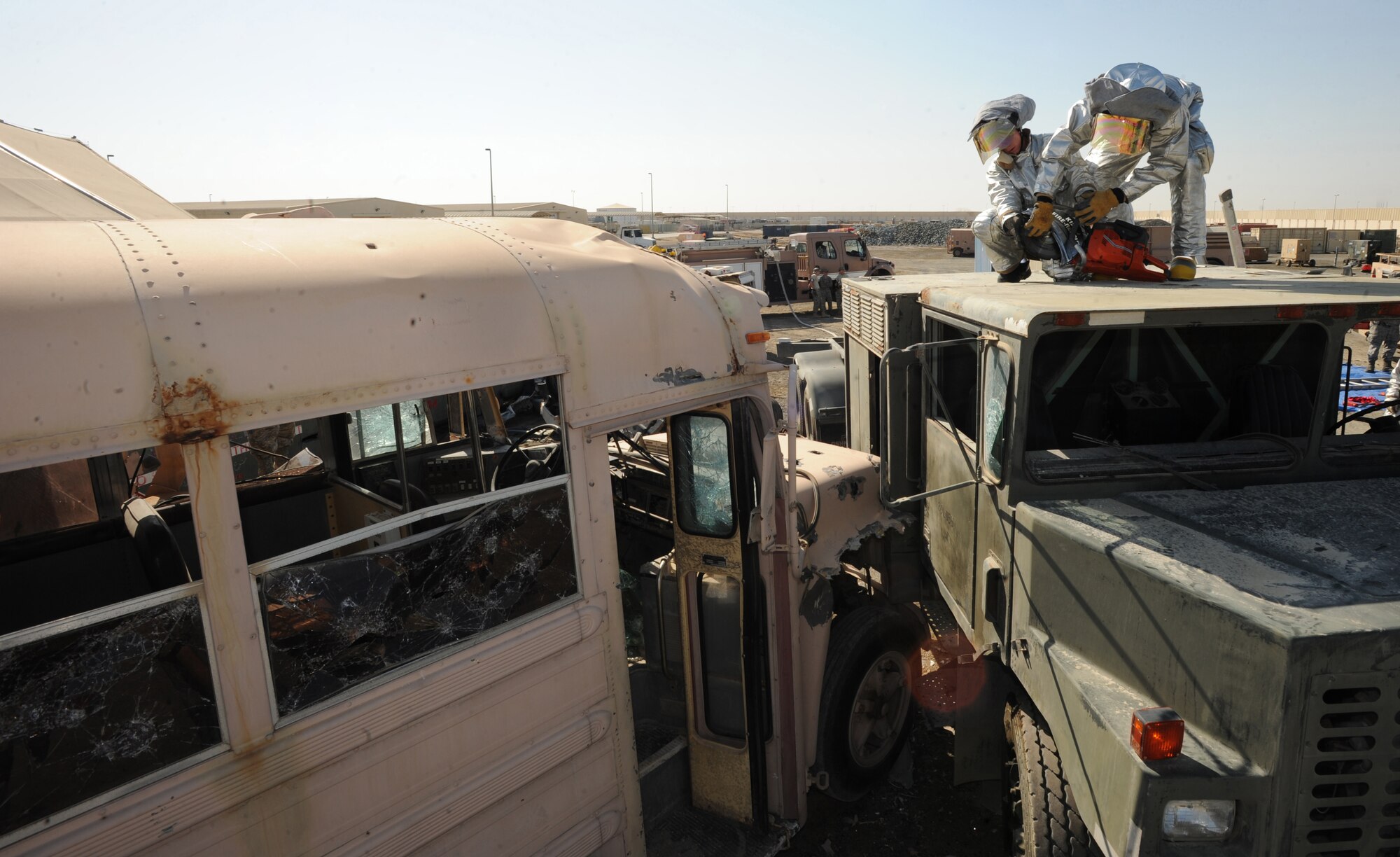As part of the Auto Extrication Exercise, 380th Expeditionary Civil Engineer Squadron firefighters tear into the roof of a truck Jan. 28, 2011. These exercises keep the Airmen updated in their training which produce quick decision-making responses and save lives during real world scenarios. (U.S Air Force photo by Senior Airman Maynelinne De La Cruz)