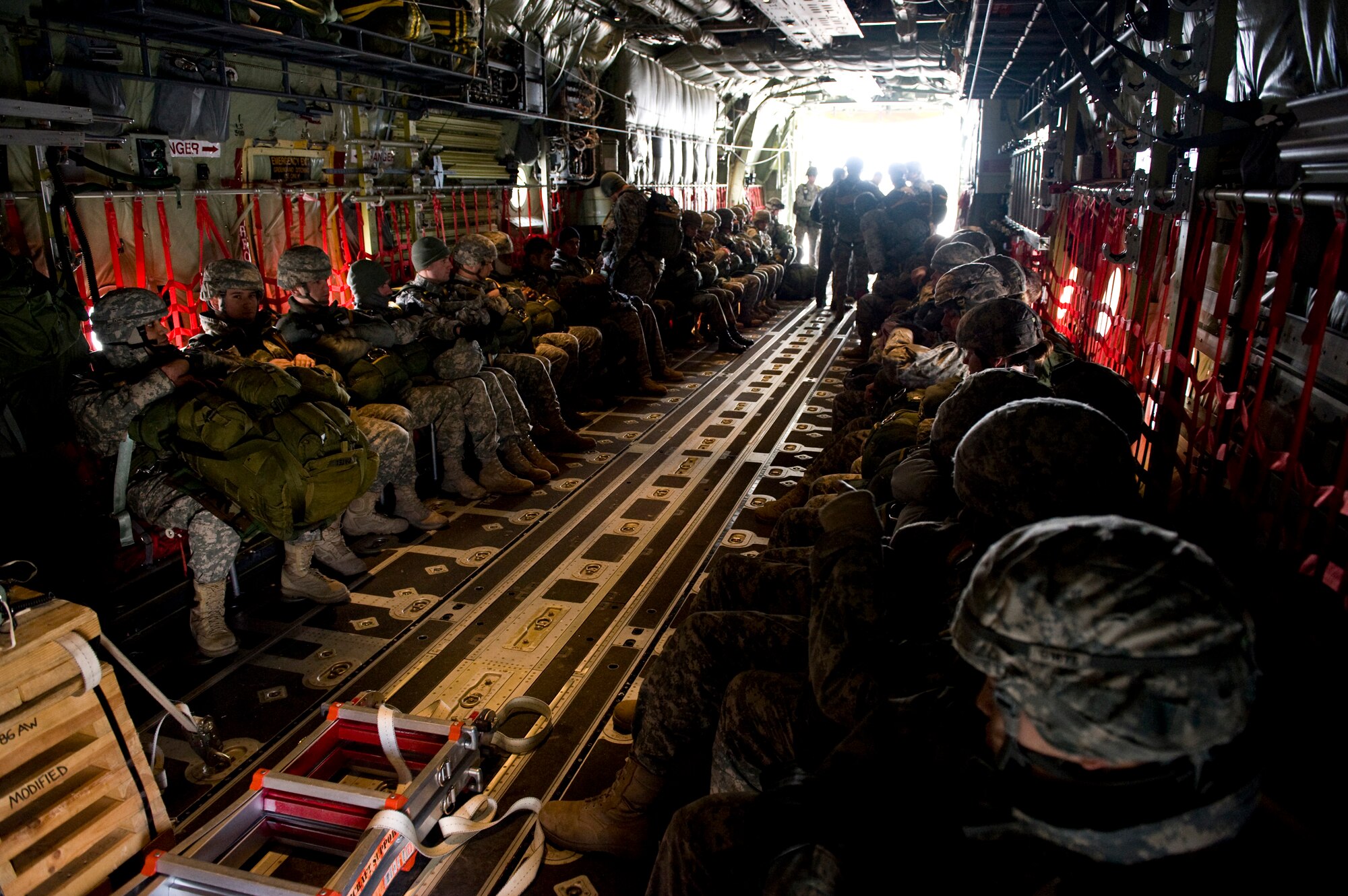 U.S. Army Soldiers, Air Force Airmen and German soldiers prepare for takeoff aboard a C-130J Hercules, from Ramstein Air Base, Germany, in preparation for a training airdrop over drop zone Marnheim, Germany, Feb. 10, 2011. The single C-130J aircraft from the 37th Airlift Squadron, 86th Airlift Wing dropped more than fifty service members at the drop site.  (U.S. Air Force photo/TSgt Wayne Clark, AFNE Regional News Bureau) (Released)