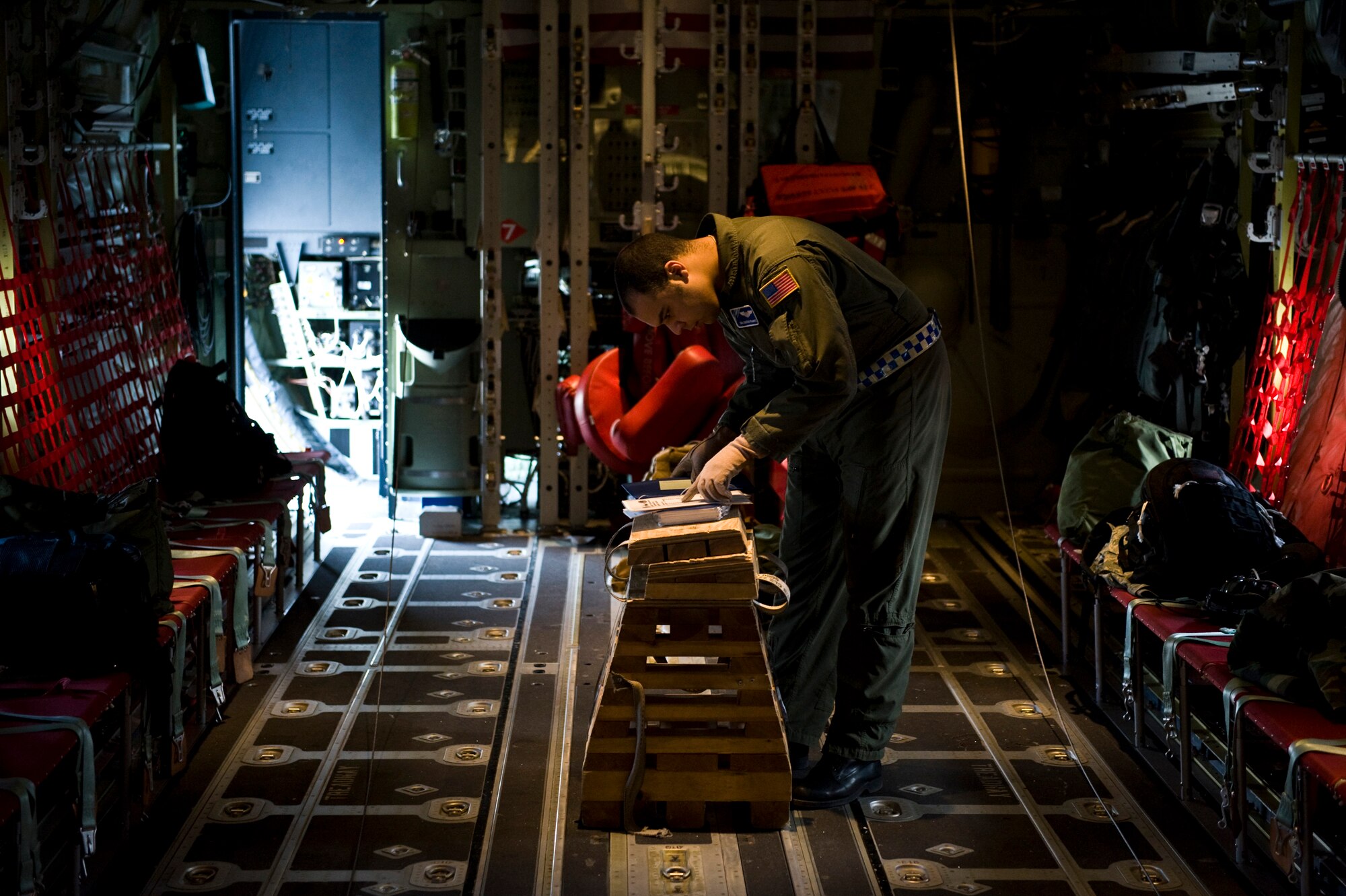 U.S. Air Force Senior Airman Dustin Franks, 37th Airlift Squadron, reviews the aircraft checklist of a C-130J Hercules, from Ramstein Air Base, Germany in preparation of an airdrop mission over the Marnheim, Germany drop zone, Feb. 10, 2011. The single C-130J aircraft from the 37th Airlift Squadron, 86th Airlift Wing dropped more than fifty service members at the drop site.  (U.S. Air Force photo/TSgt Wayne Clark, AFNE Regional News Bureau) (Released)
