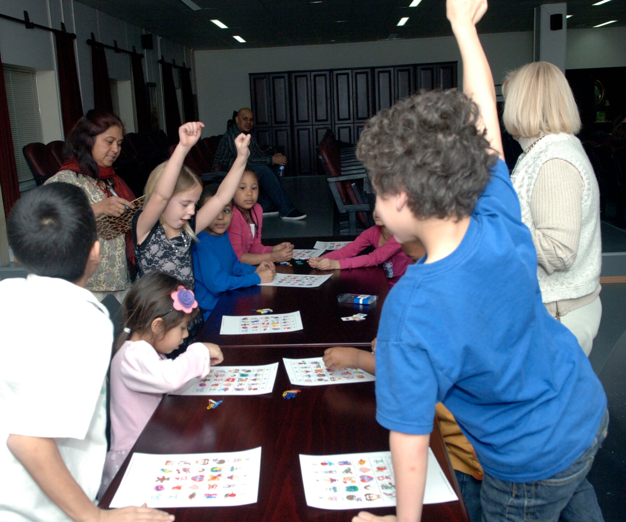 Children of deployed personnel participate in games of Bingo during the Hearts Apart dinner held Feb. 11, 2011, at the Airman and Family Readiness Center on Incirlik Air Base, Turkey.  The Hearts Apart program brings both spouses and children of deployed military personnel together and gives them the opportunity to interact with other individuals who may be going through the same situation.