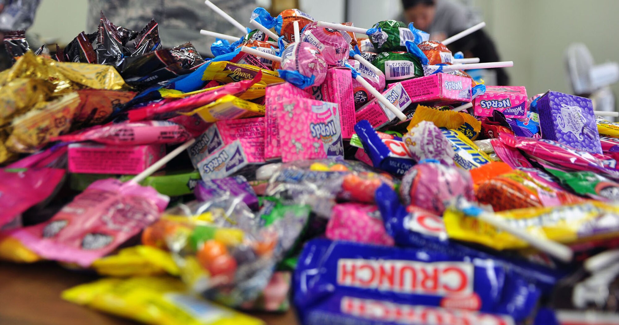 YOKOTA AIR BASE, Japan -- Volunteers from the 374th Logistics Readiness Squadron, along with Key Spouse committee members, sort and pack items here Feb. 9, for care packages to be sent to deployed squadron personnel. (Courtesy photo) 