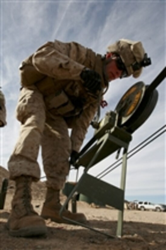 U.S. Marine Corps Lance Cpl. Joseph J. Gefhard, with Headquarters and Service Company, 3rd Battalion, 4th Marine Regiment, sets up an antenna during Mojave Viper at Marine Corps Air Ground Combat Center, Twentynine Palms, Calif., on Jan. 25, 2011.  Mojave Viper is a 30-day exercise that prepares Marines for deployment to Afghanistan.  