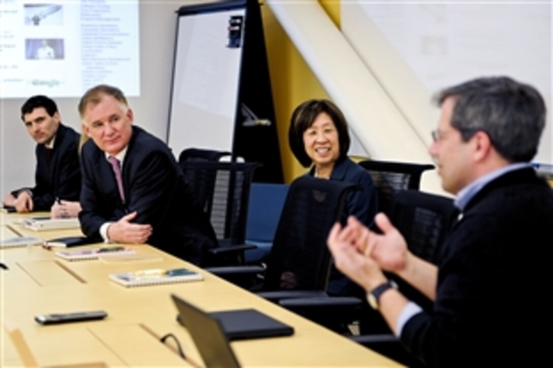 Deputy Defense Secretary William J. Lynn III, second from left, listens as Google representatives brief him on the process of cloud computing during a meeting in San Francisco, Feb. 14, 2011. Lynn met with industry leaders to discuss best practices in cyberdefense. Cloud computing is a term used for information that is hosted online, rather than on a personal computer. 