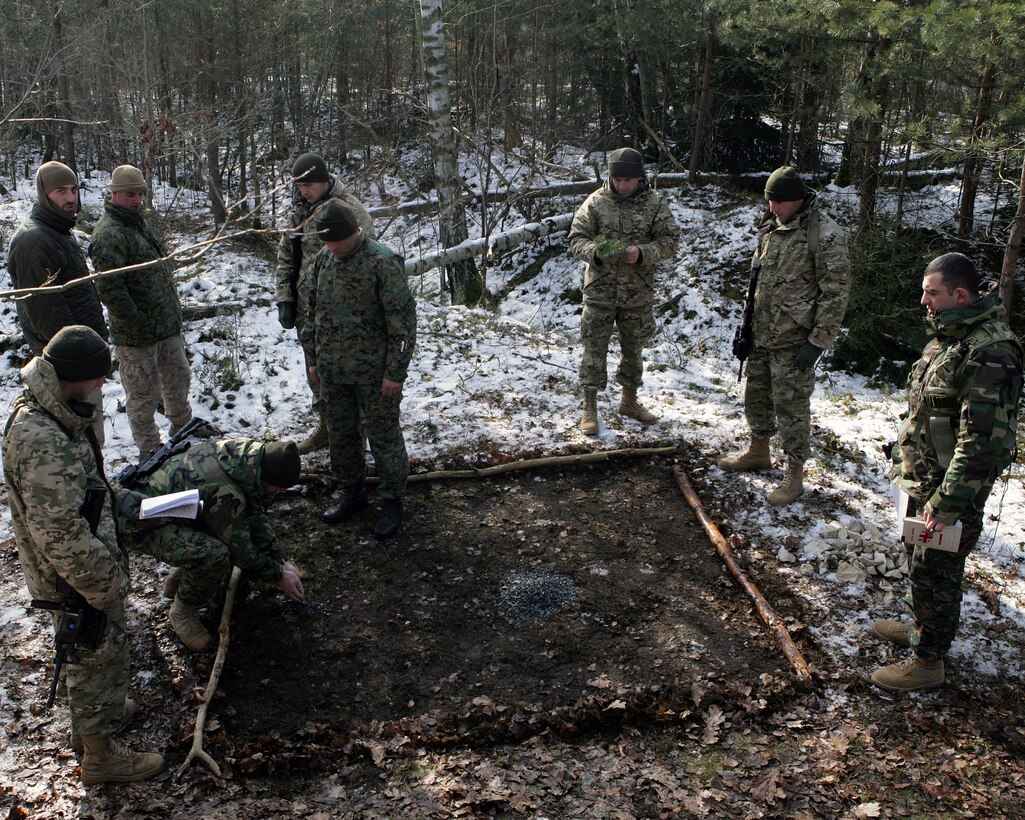 Soldiers with the Republic of Georgia’s 33rd Light Infantry Battalion prepare a terrain model prior to a mechanized live-fire drill. These soldiers are currently deployed here from Georgia conducting a mission rehearsal exercise as part of the Georgia Deployment Program- International Security Assistance Force (GDP-I) prior to their deployment to Afghanistan. The GDP-I is a two-year, time-phased, program which prepares four battalions, one every six months, to be able to integrate with ISAF in Afghanistan. The 33rd Light Infantry Battalion is scheduled to replace the 32nd Light Infantry Battalion, which is currently deployed and partnered with other ISAF units.