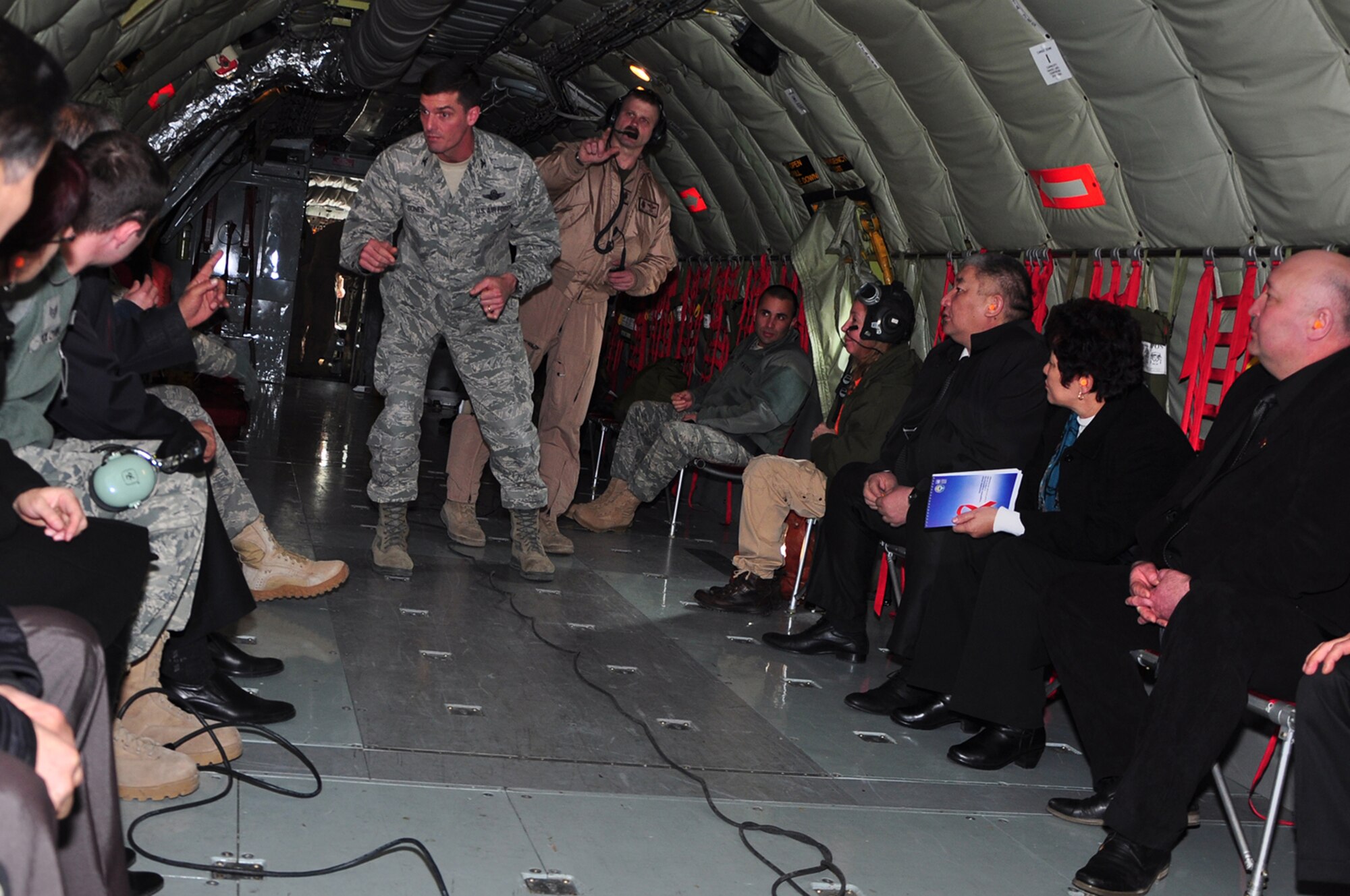 TRANSIT CENTER AT MANAS, Kyrgyzstan - Col. Dwight Sones, 376th Air Expeditionary Wing commander, fields questions from Kyrgyz parliamentarians prior to take off on a KC-135 Stratotanker  on a first-ever flight for members of the parliament 16 Feb.  Parliament members were taken on the aircraft for a demonstration refueling mission with a C-17 Globemaster III over the skies of Kyrgyzstan. This demonstration of air power highlighted to the parliamentarians the role of the Aerial Refuel mission here, one of the Transit Center's four mission pillars. The other three pillars which were highlighted in the pre-flight briefing are Onward Movement, Airlift and Humanitarian Assistance. (U.S. Air Force photo/Master
Sgt. Daniel Nathaniel)
