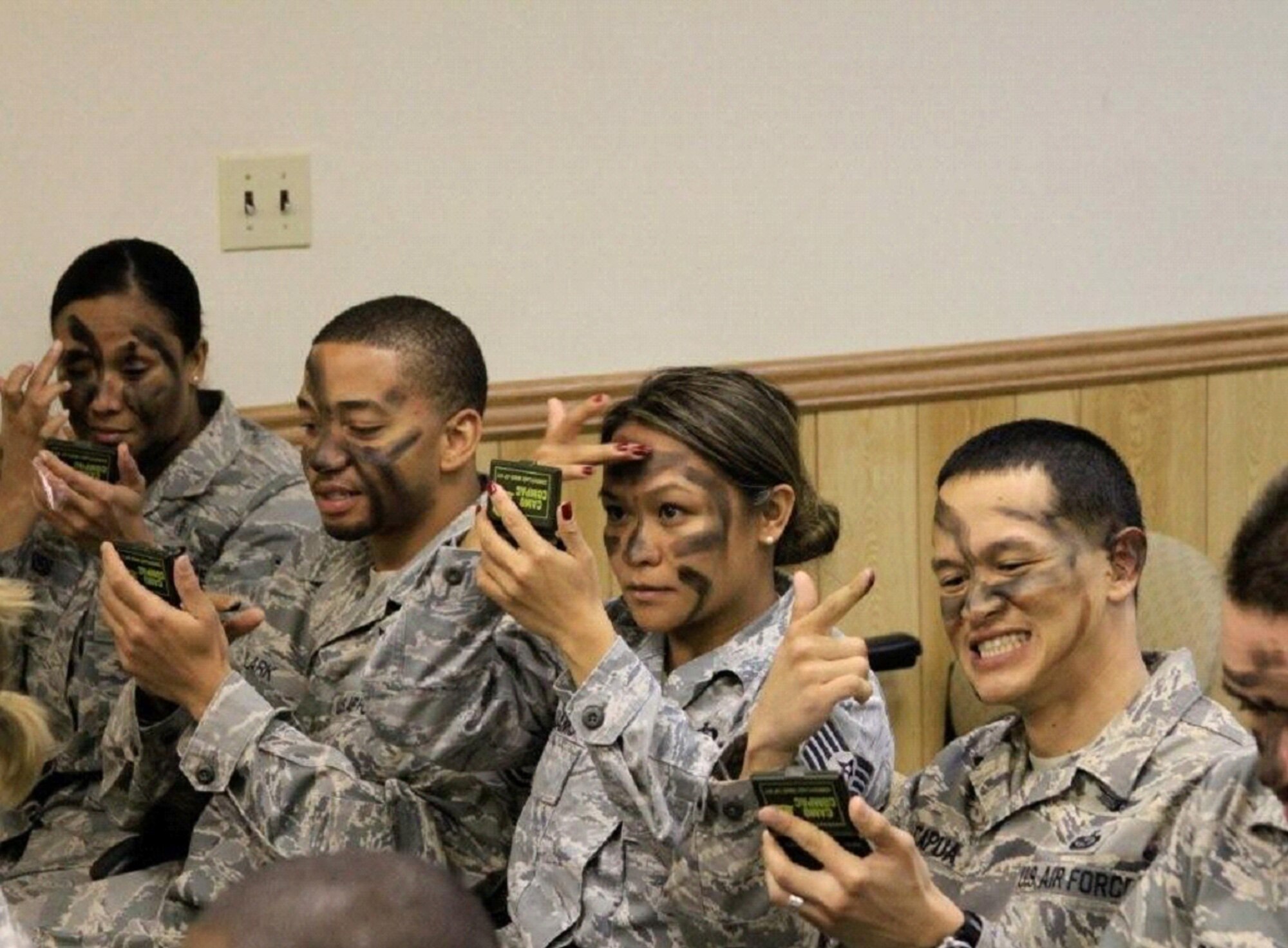 KADENA AIR BASE, Japan -- NCOs from The Erwin Professional Military Education Center's NCO Academy Class 11-2 Air Commando Flight learn the proper way to apply camouflage face paint during a visit to the 320th Special Tactics Squadron.  This is the first time the 353rd Special Operations Group has hosted the Air Commando Flight.  The group hopes to build a lasting bond with their namesake.  (Courtesy photo)