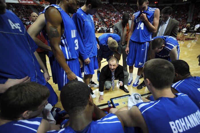 LAS VEGAS -- Jeff Reynolds, U.S. Air Force Academy "Falcons"  basketball team, head coach, discusses team strategy in the huddle during a time out against the University of Nevada Las Vegas, at the Thomas and Mack Center, Feb. 15. The Air Force Falcons came up short against  UNLV 49-42, making their record 13-11 overall and 4-7 in the Mountain West Conference. (U.S. Air Force photo by Airman 1st Class Daniel Hughes)