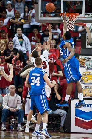 LAS VEGAS --  Tre'Von Willis, University of Nevada Las Vegas "Runnin' Rebels" senior guard, scores a lay-up over the  U.S. Air Force Academy "Falcons" defenders at the Thomas and Mac Center Feb. 15. The Air Force Falcons came up short against  UNLV 49-42, making their record 13-11 overall and 4-7 in the Mountain West Conference. (U.S. Air Force photo by Tech Sgt. Michael R. Holzworth)